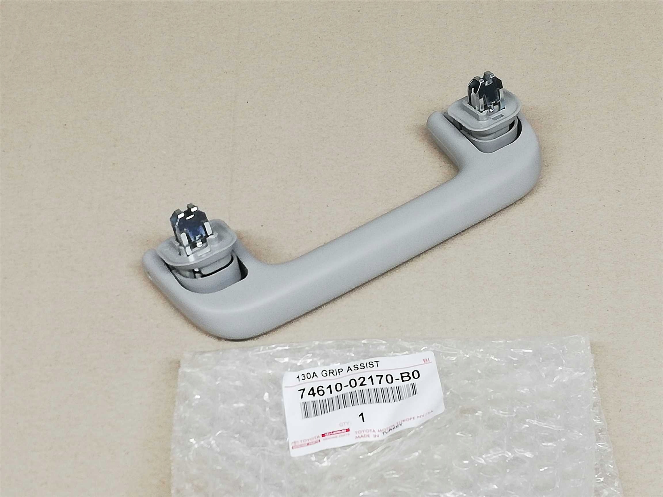 AURIS II 12-18 E18 UCHWYT RĄCZKA DACH PODSUFITKA Numer katalogowy części A74610-02170-B0