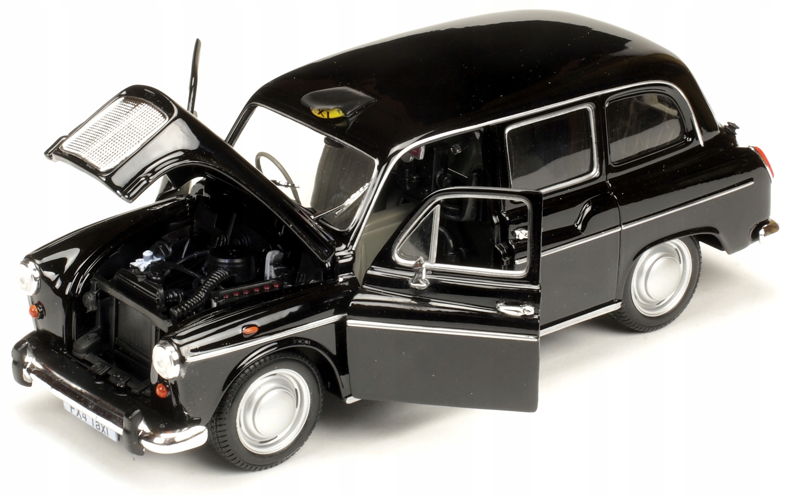 

Metalowe Auto Austin FX4 London Taxi Welly 1:24