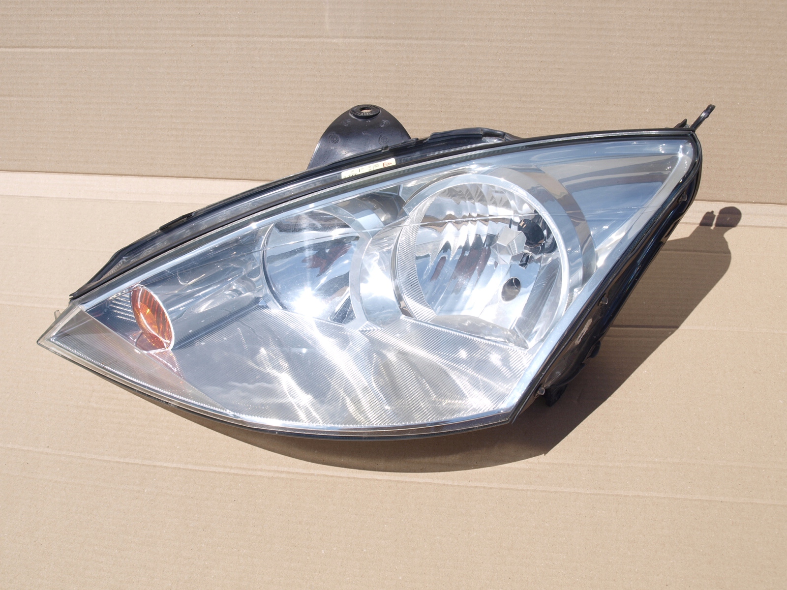 Фара на фокус 1. Фара фокус 1. Фара форд фокус 1 европеец. Ford focus 1 фары. Фары форд фокус 1 американец.