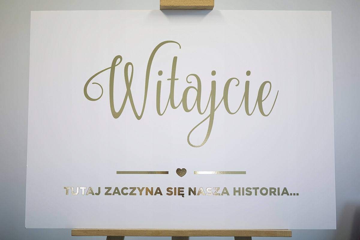 

Tablica weselna Witamy Gości biała złota 100x70cm
