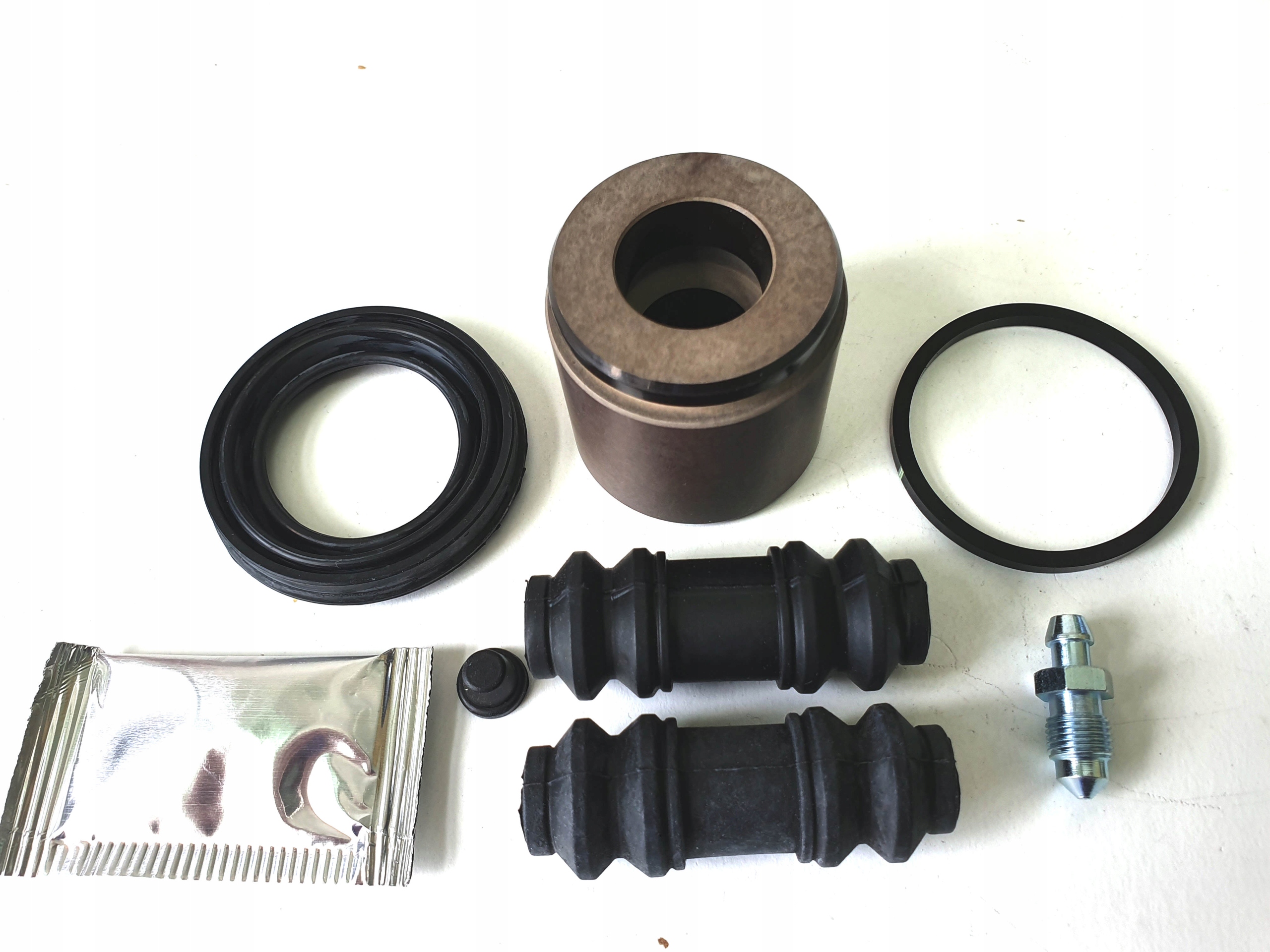 JEEP LIBERTY CHEROKEE TŁOCZEK ZACISK TYŁ 2002-2007