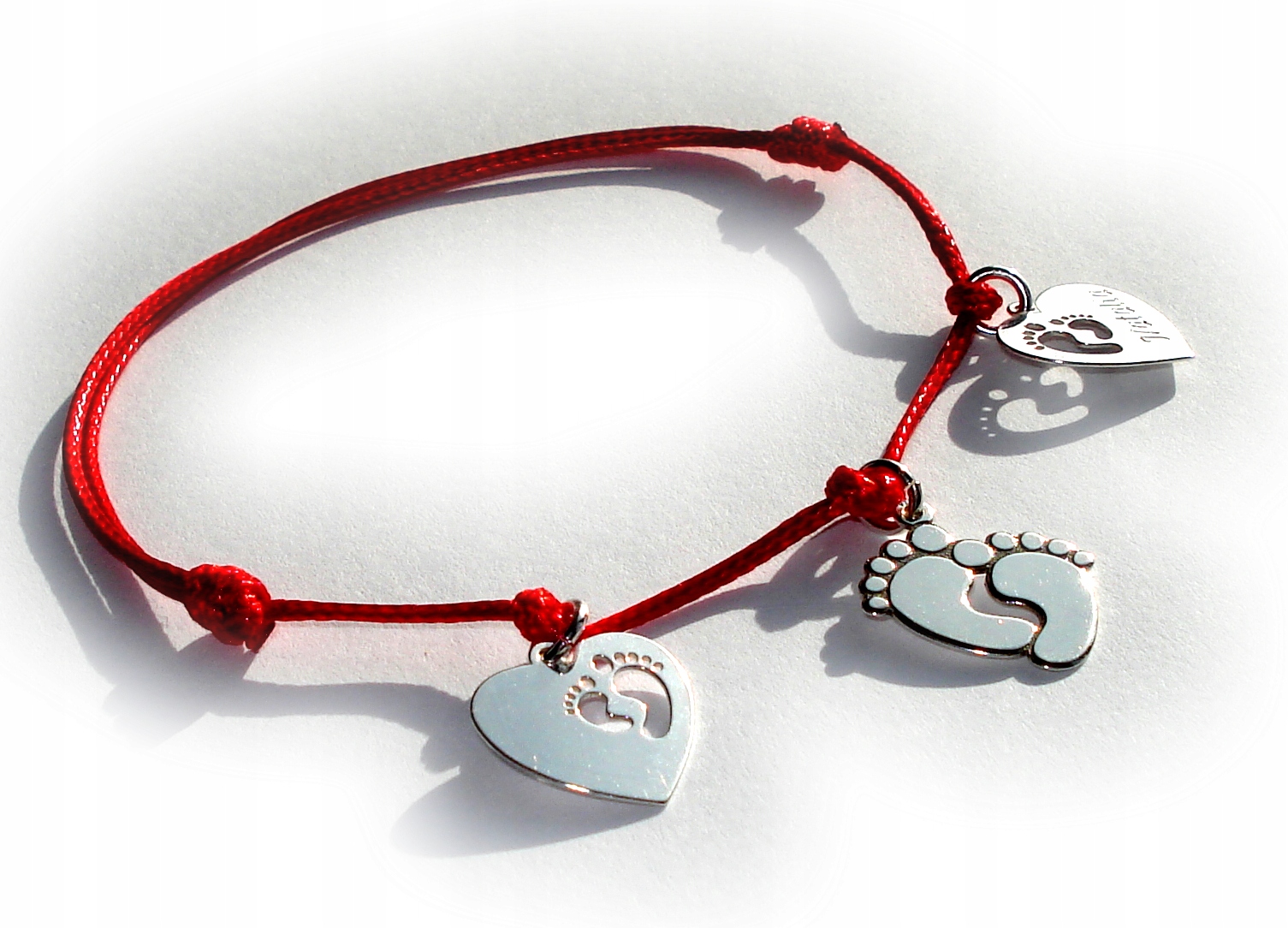 

Bransoletka sznurkowa stópki serce Grawer Srebro