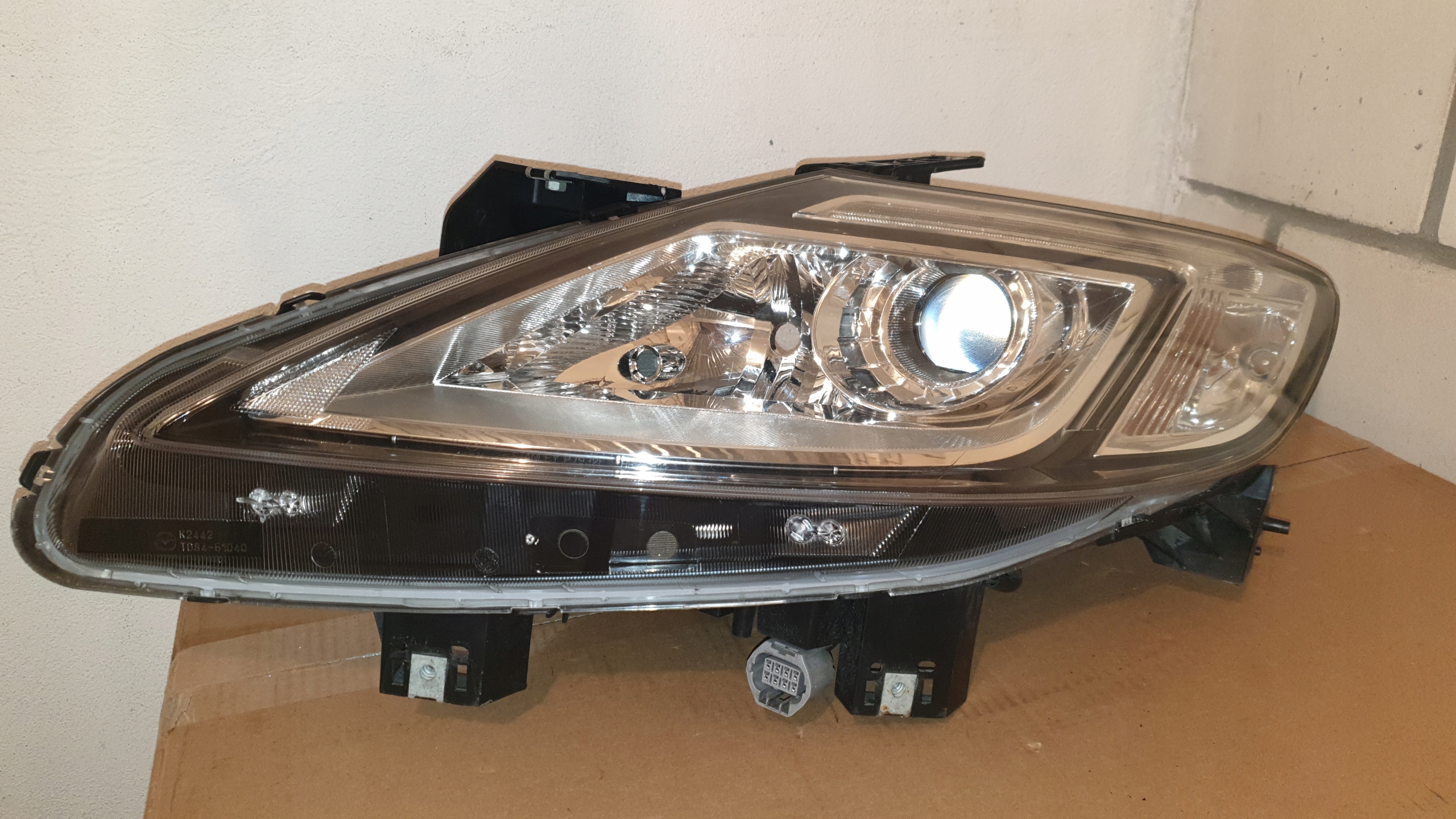 MAZDA CX9 20062009 REFLEKTOR LEWY LAMPA WERSJA EU