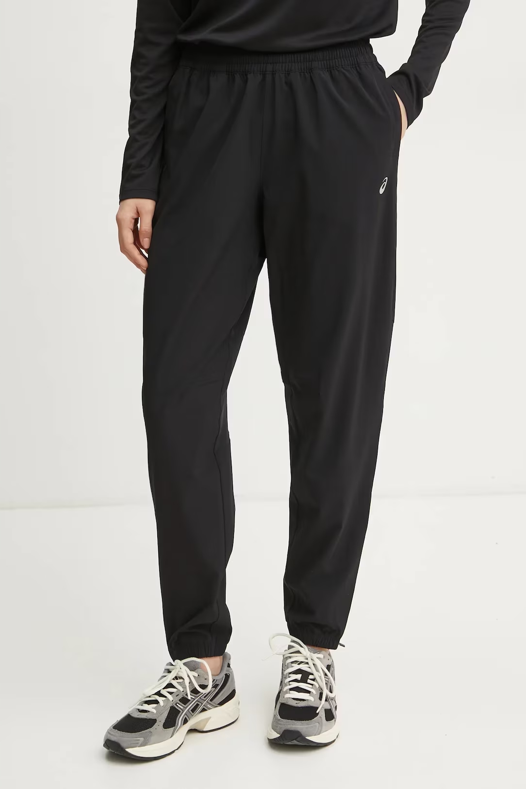 Asics běžecké kalhoty Core černá hladká barva 2012D176 M