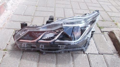 LAMPA LEWA REFLEKTOR TOYOTA COROLLA E21 SEDAN 19-
