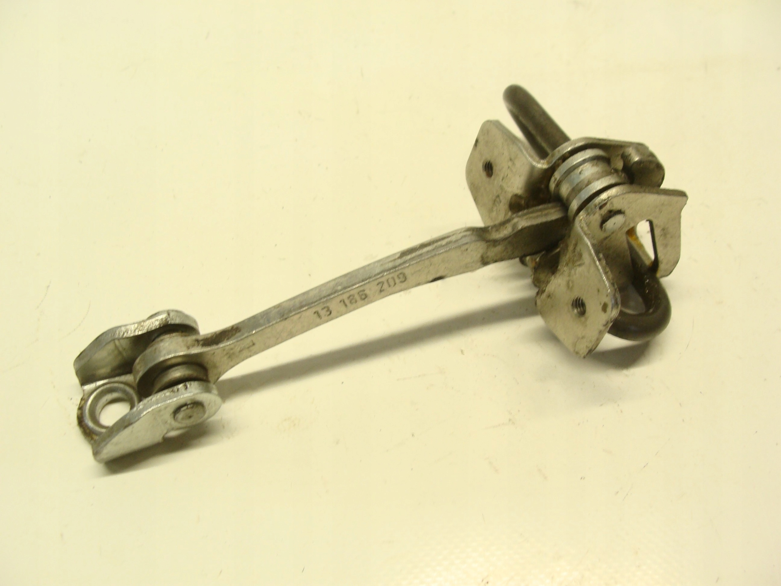 OPEL MERIVA A OGRANICZNIK DRZWI TYŁ 13186209