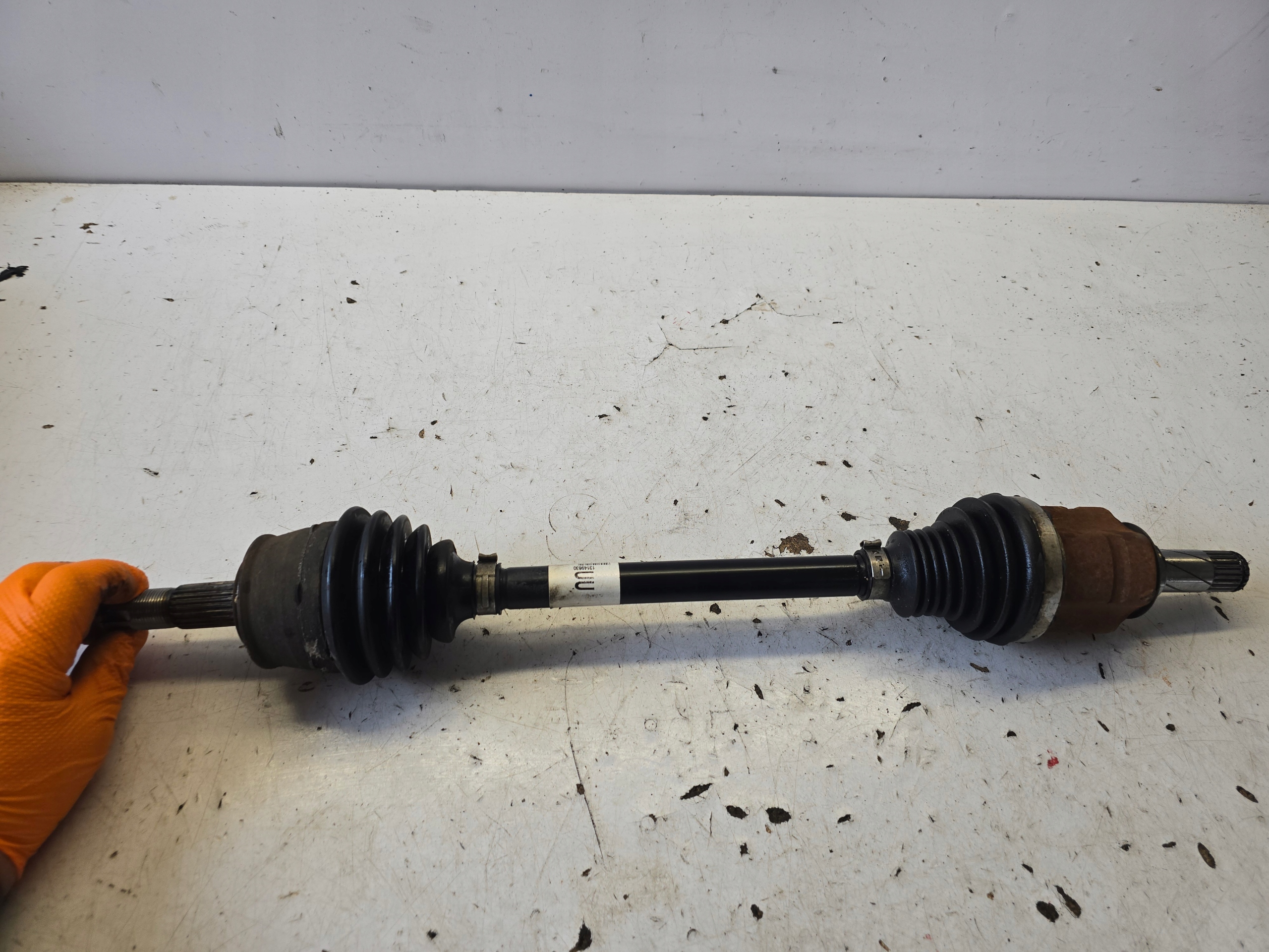 OPEL CORSA E semi-axis left short. 13149830 UU