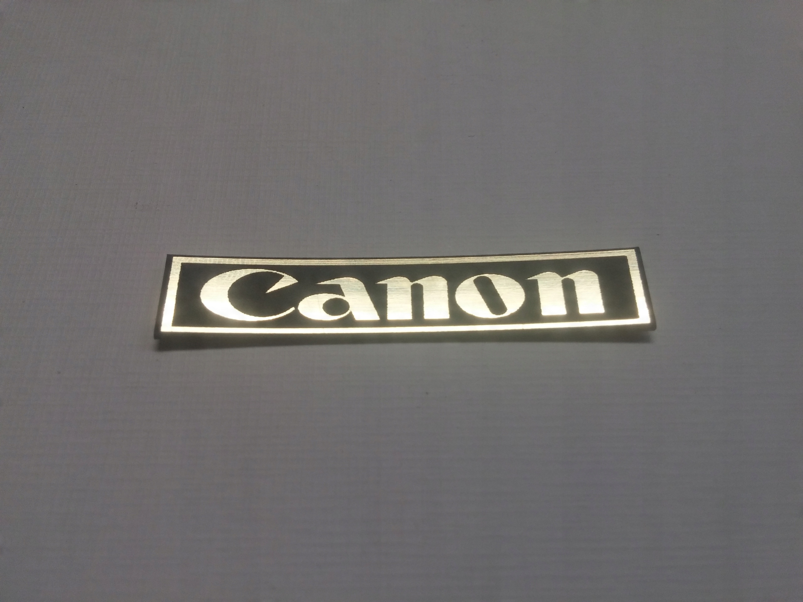 

Canon naklejka emblemat 25 x 5 mm *złota