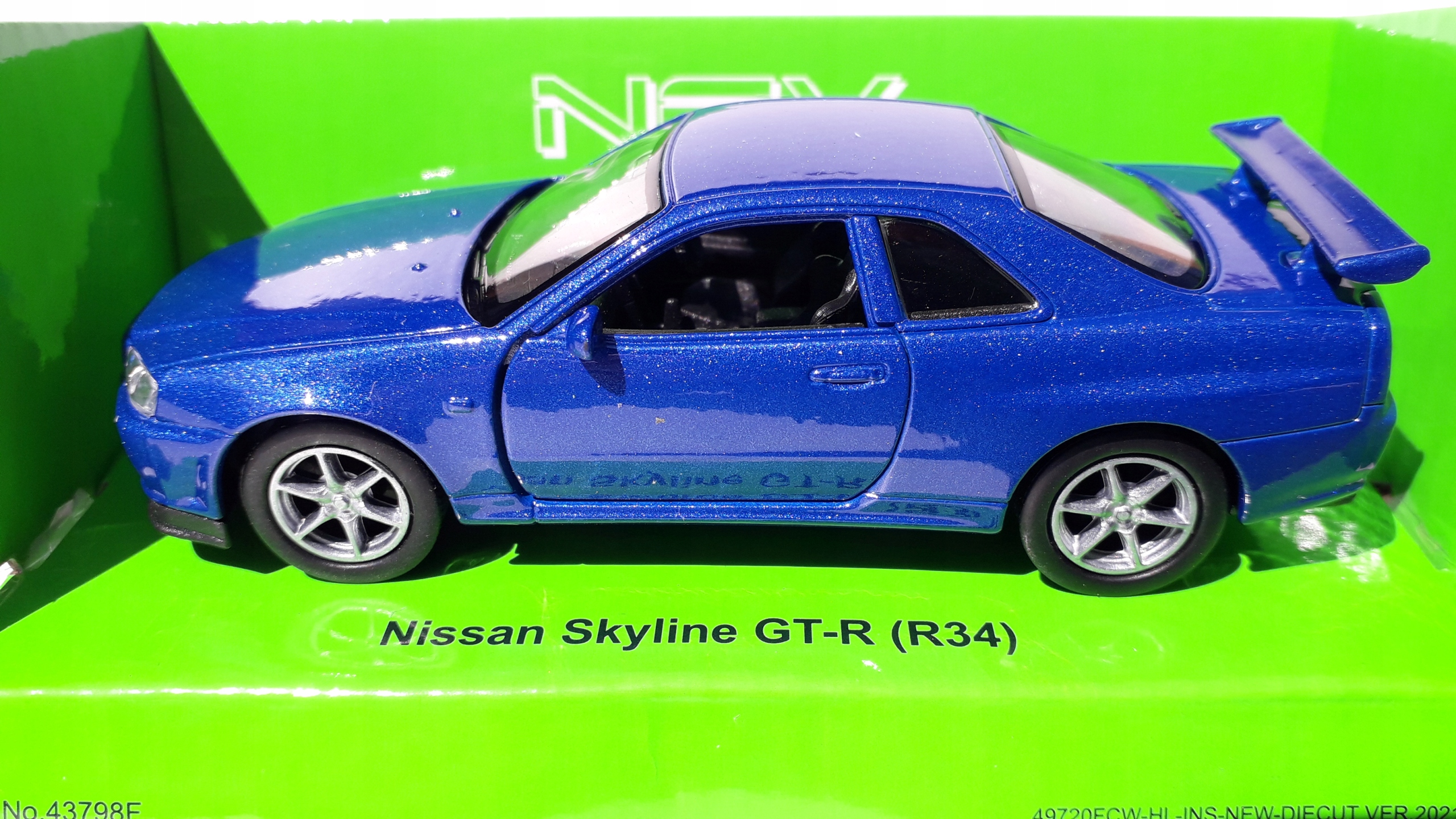 Nissan Skyline GT-R(R34) Niebieski Metalowy Model WELLY 1:34 Płeć chłopcy dziewczynki