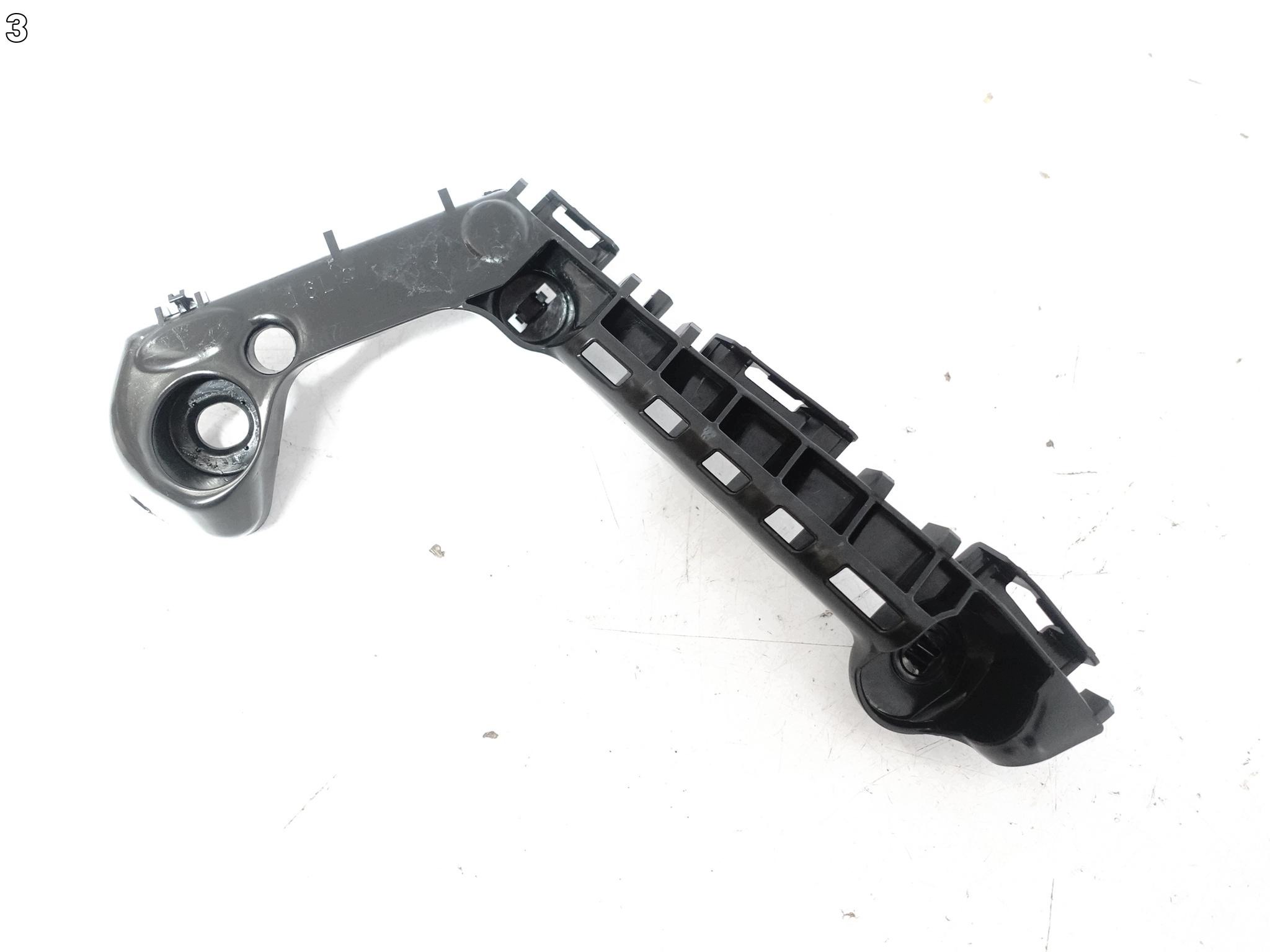 TOYOTA COROLLA E21 XII 18- support holder W bumper front left ORG