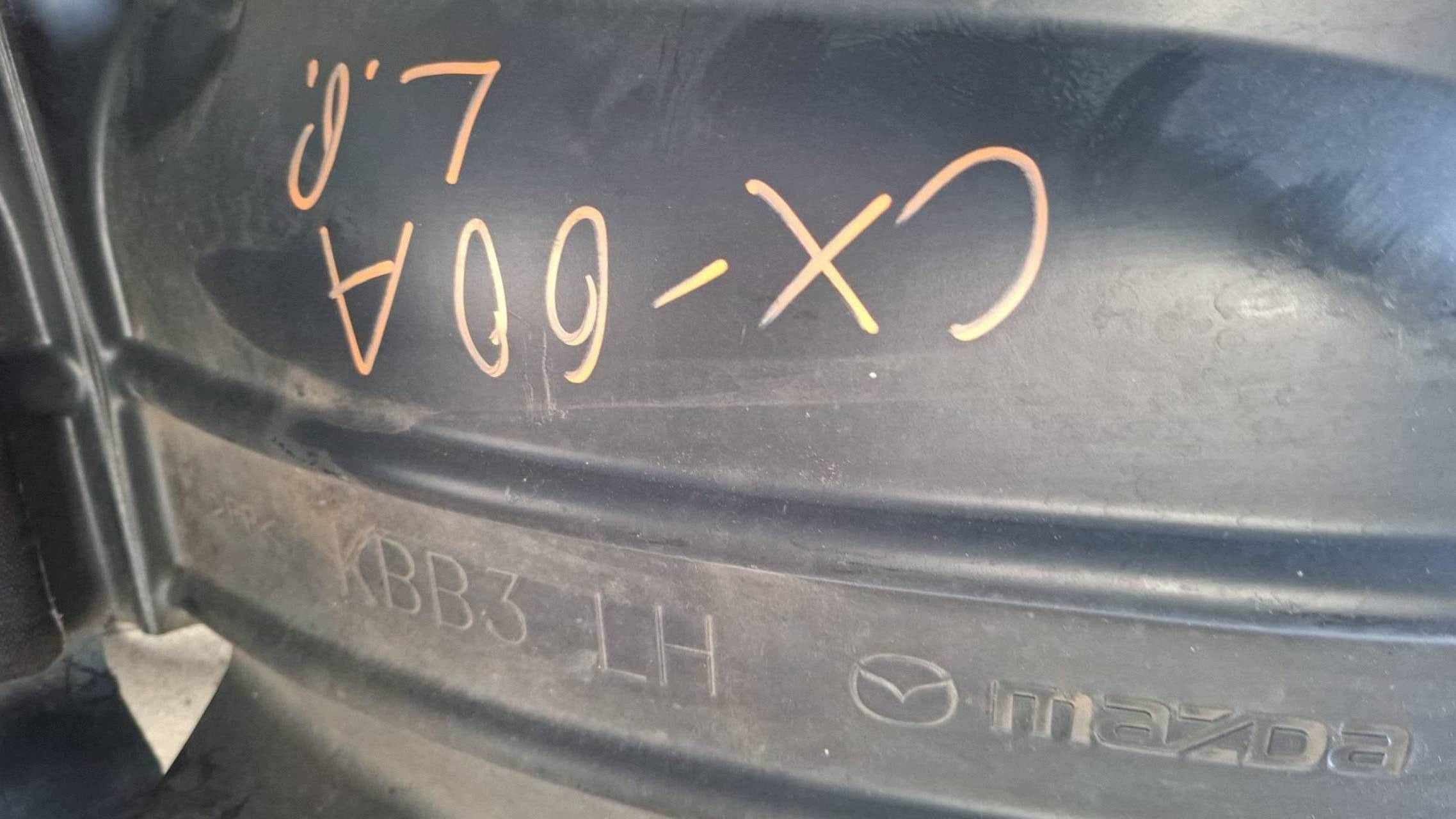 mudguard front front side left Mazda CX-60 damaged of the gripping
