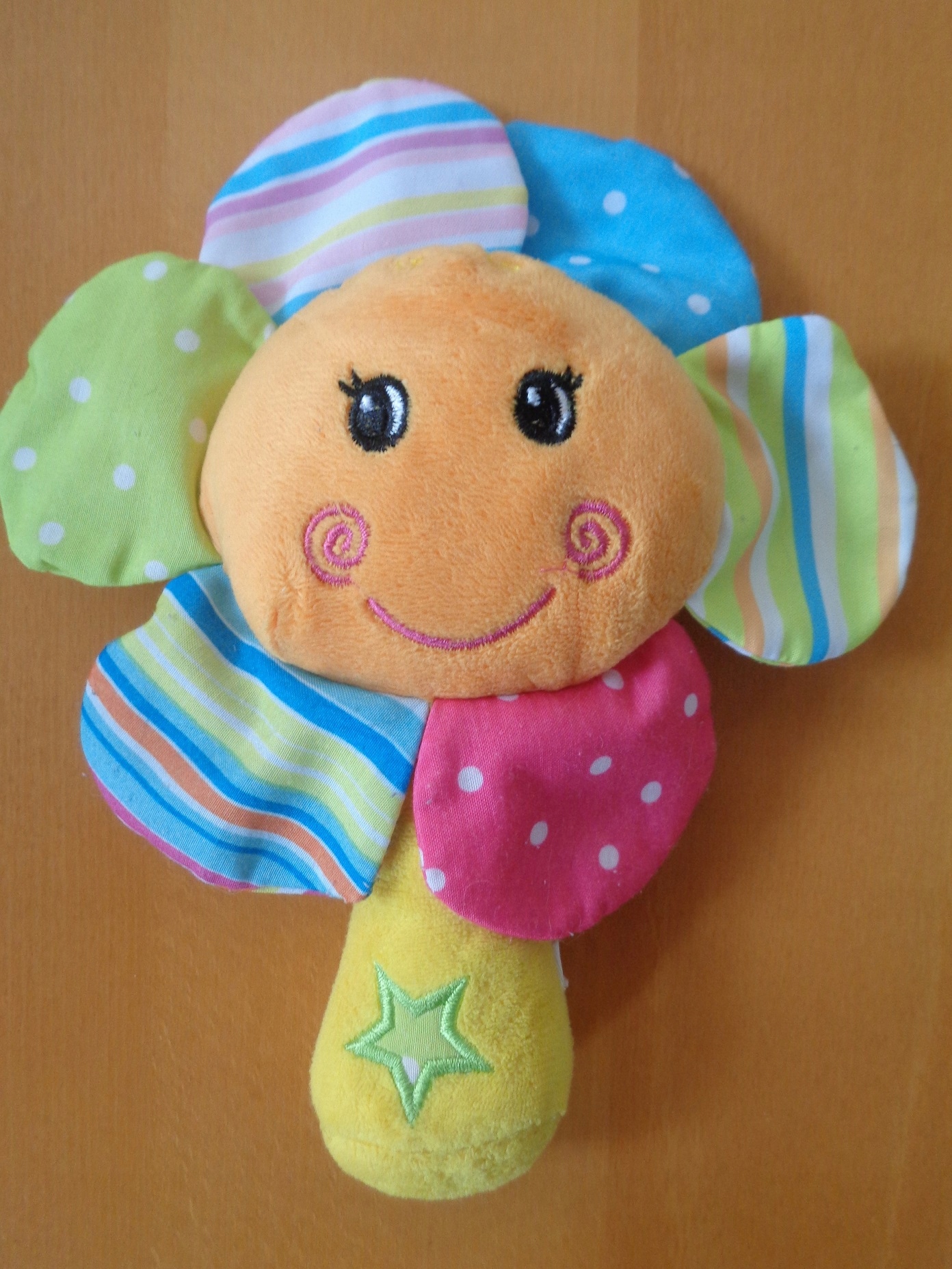 grzechotka kolorowy kwiatek