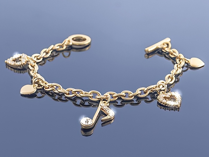 

Złota bransoletka Charms