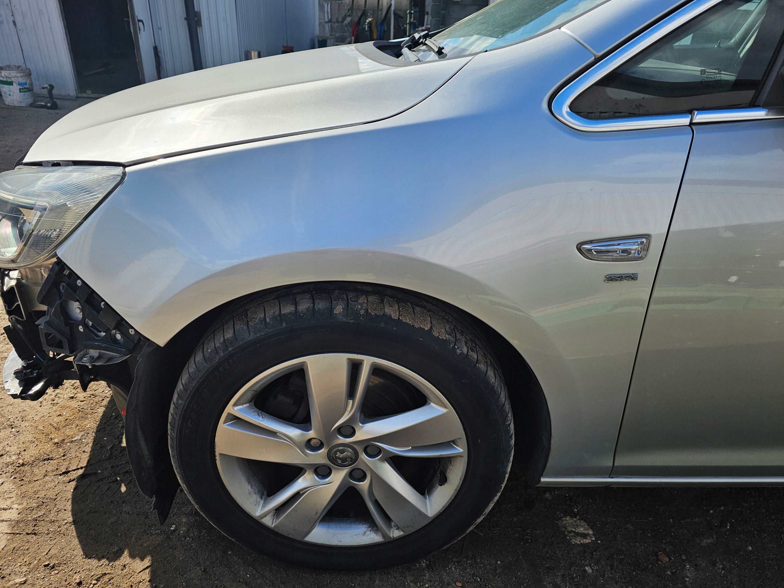 BŁOTNIK PRZEDNI LEWY OPEL ASTRA IV J Z176