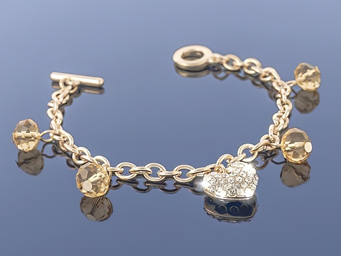 

Złota bransoletka Charms