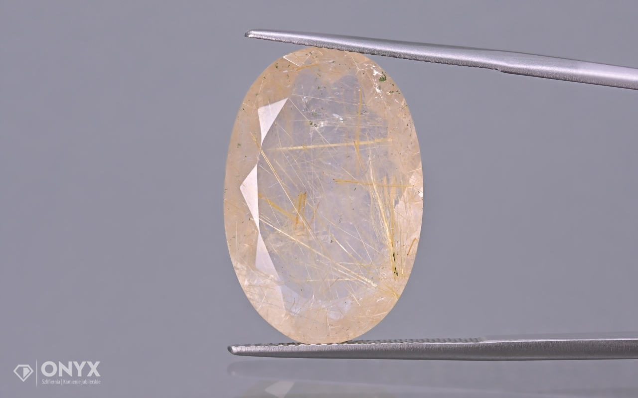 Křemen s rutilem fazetovaný ovál 23,5x15,5 mm