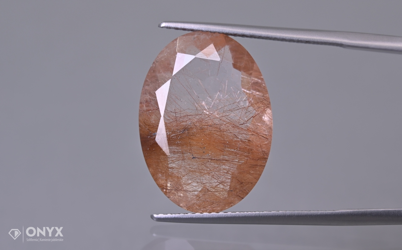 Křemen s rutilem fazetovaný ovál 20x14,5 mm