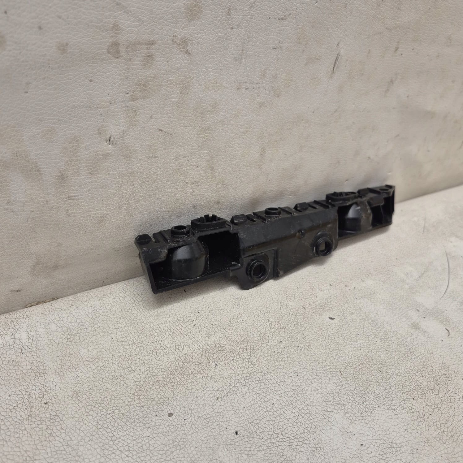 DACIA SANDERO III 3 20-> bracket holder support left rear part