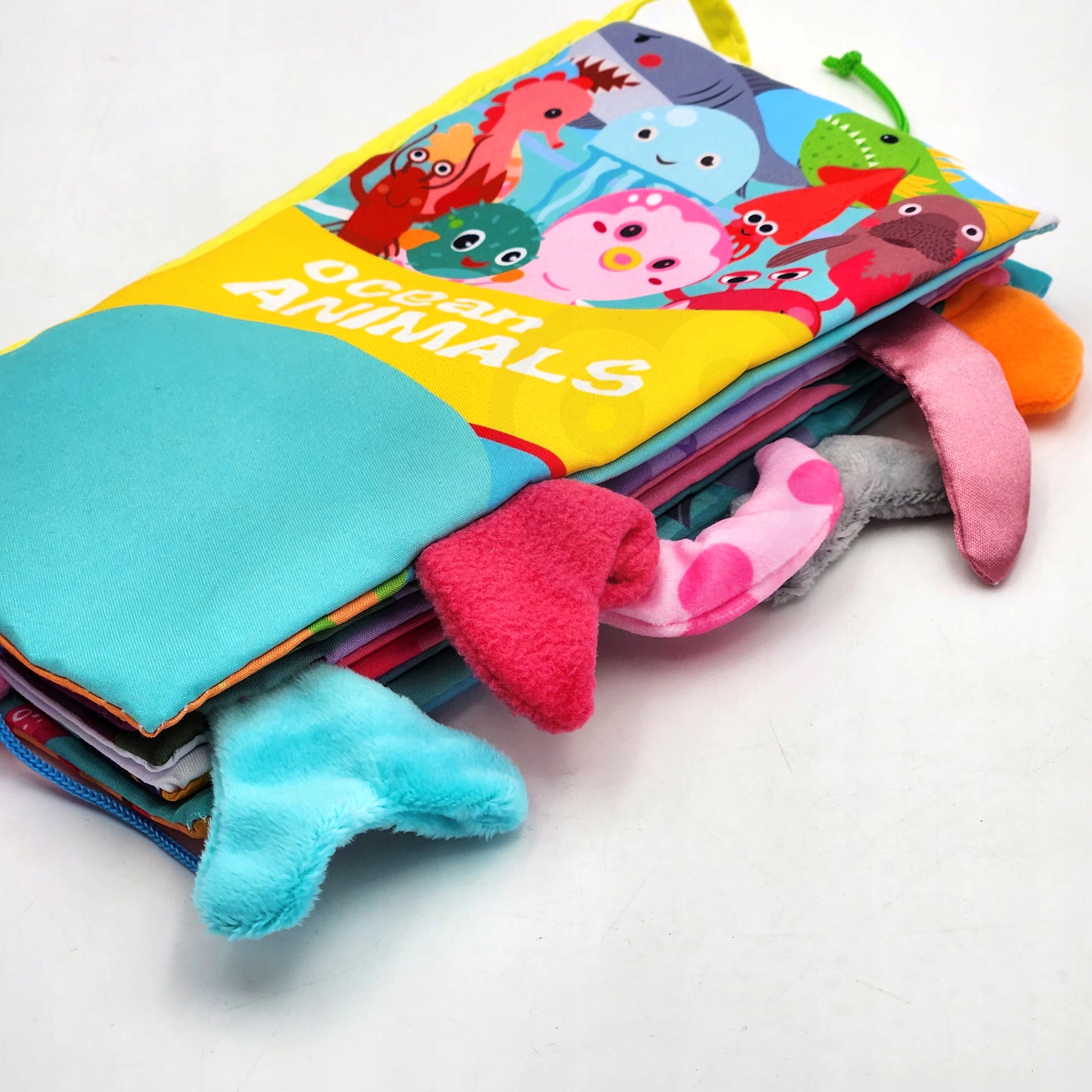 KSIĄŻECZKA ZAWIESZKA SENSORYCZNA MIĘKKA MATERIAŁ OGONKI +0m WOOPIE BABY Stan opakowania oryginalne