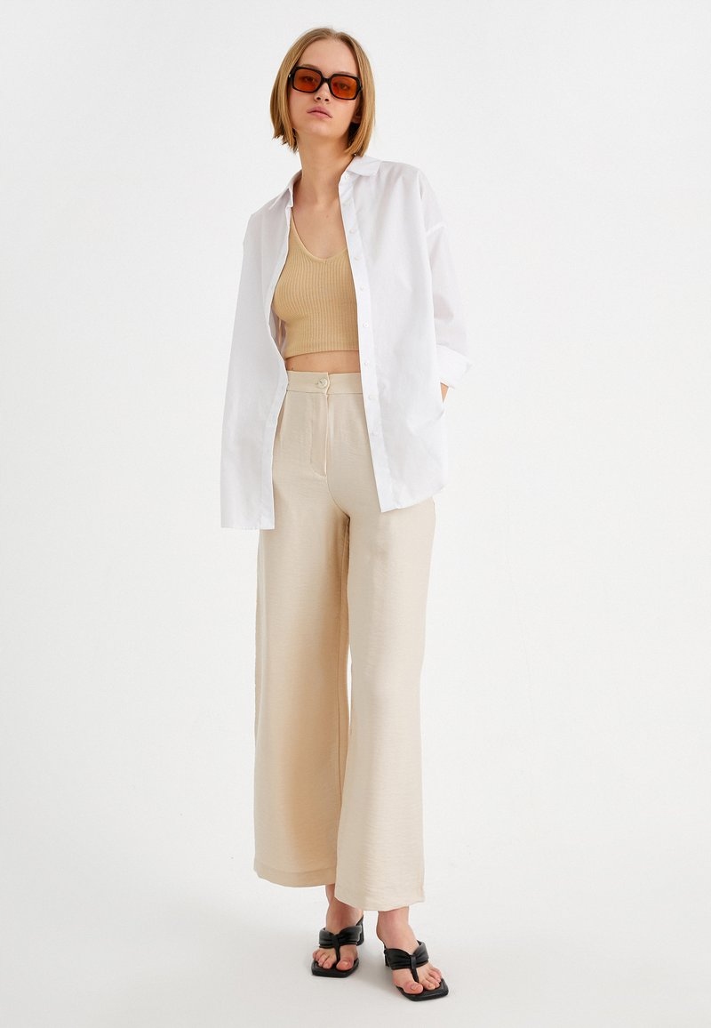 Kalhoty z látky Koton 40