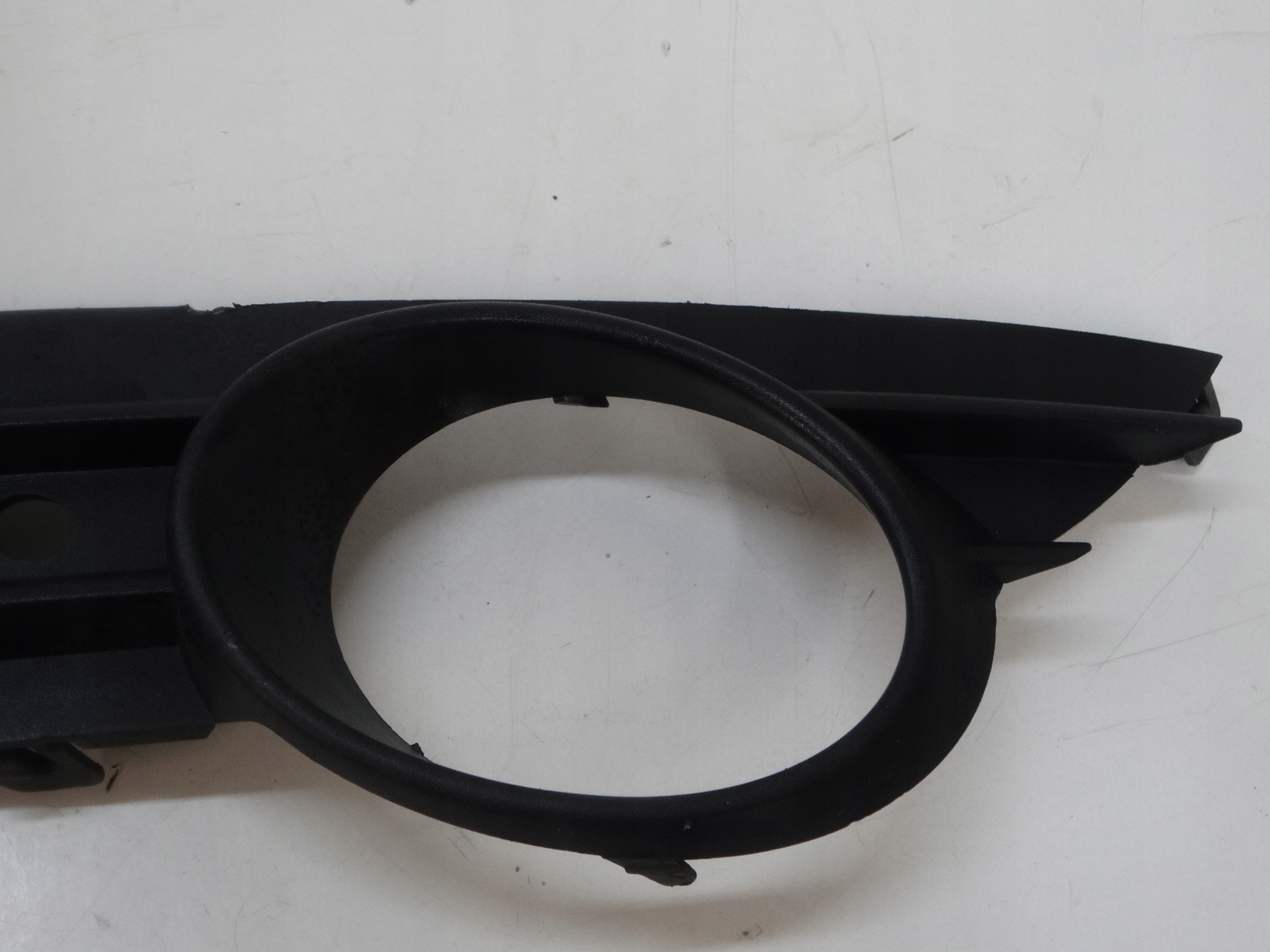 grid of a bumper left front OPEL CORSA D 13211478
