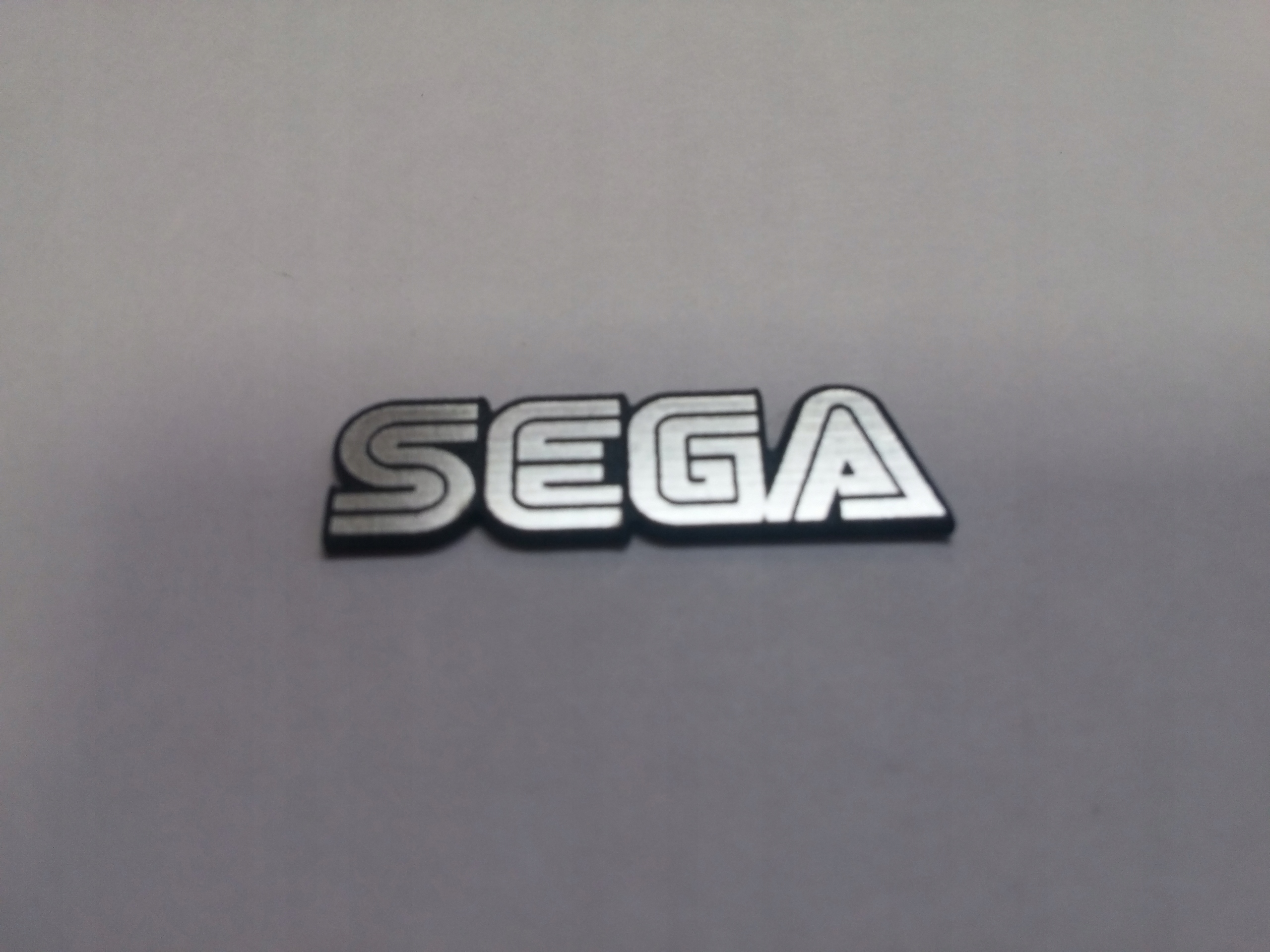 

Sega naklejka emblemat 30 x 8 mm *srebrna