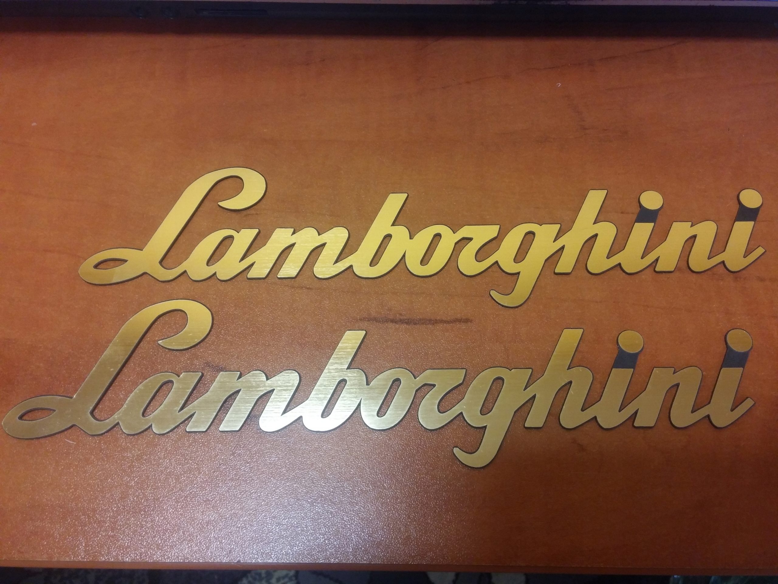 

Lamborghini naklejka emblemat 250x60 mm *złota x2