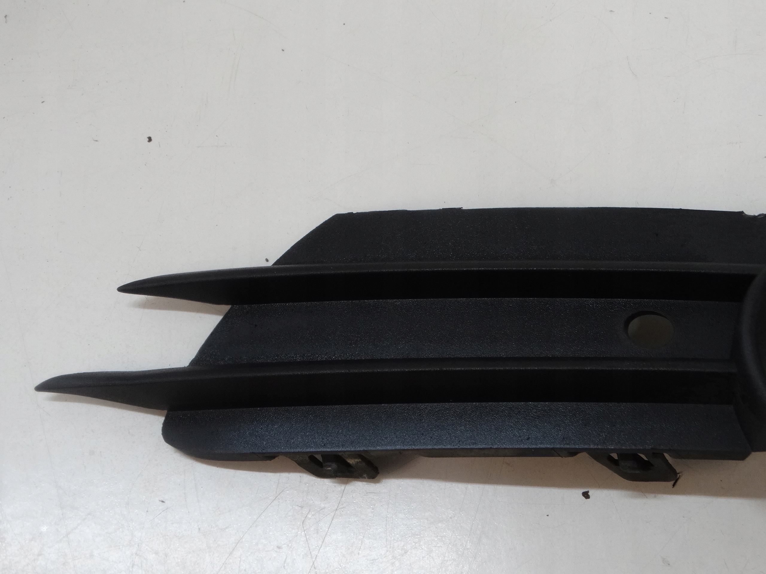 grid of a bumper left front OPEL CORSA D 13211478