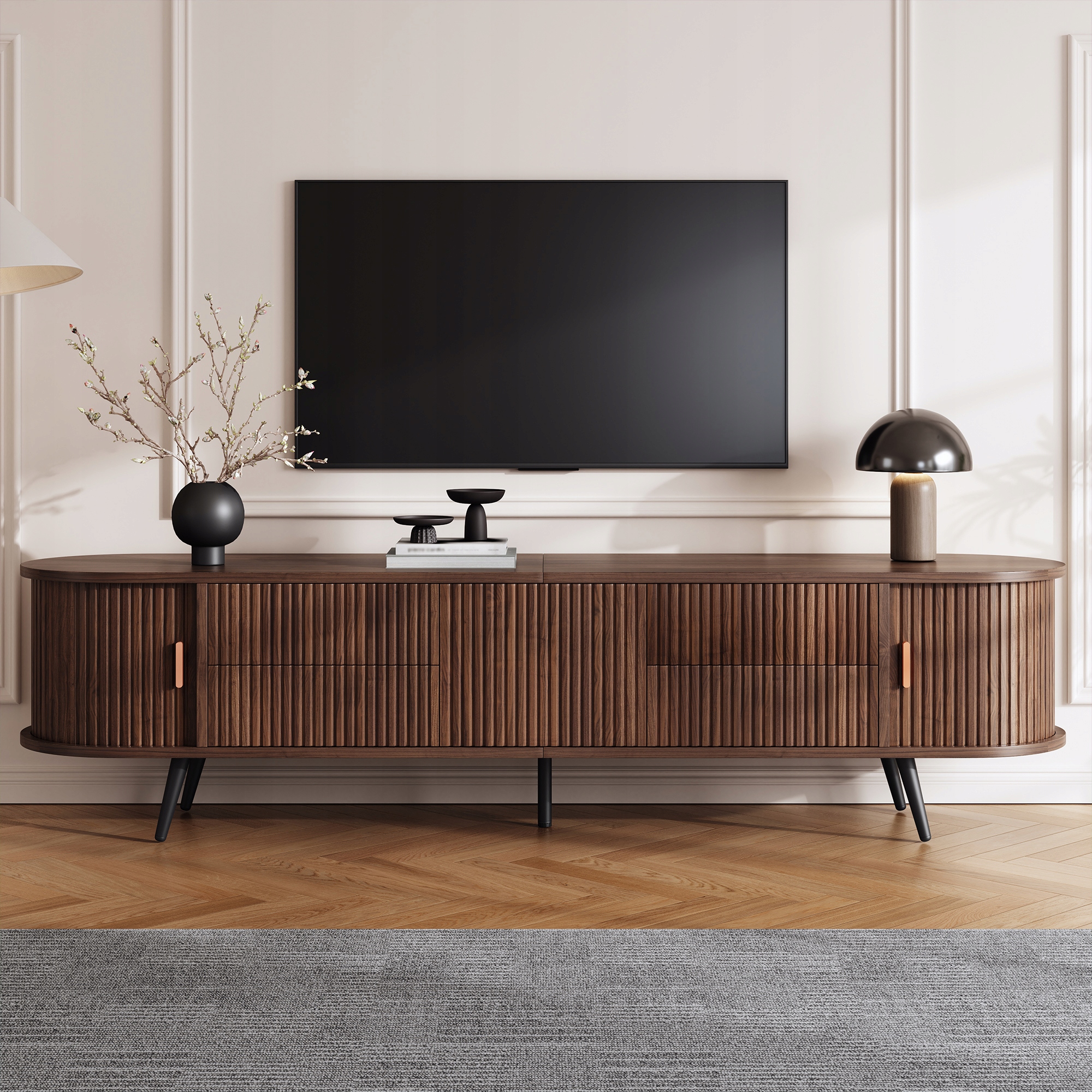 Owalna szafka RTV ma wymiary 180*40*45 cm.