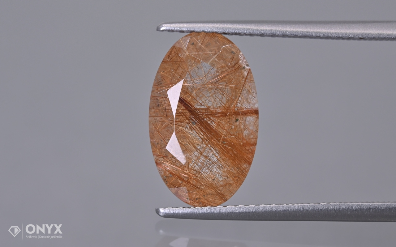 Křemen s rutilem fazetovaný ovál 14x8,5 mm