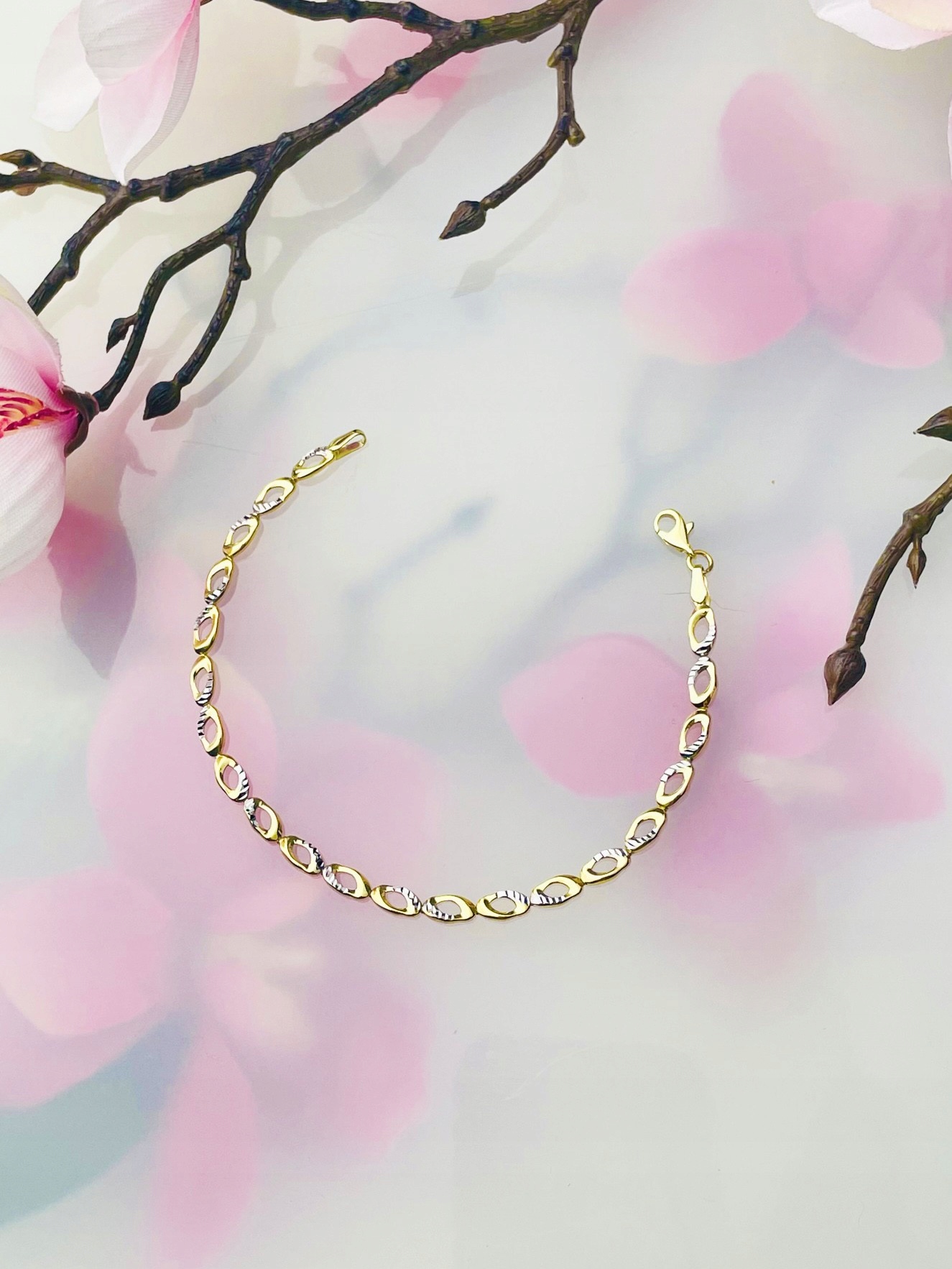 Zlatý náramek s frézovanými kruhy bikolor