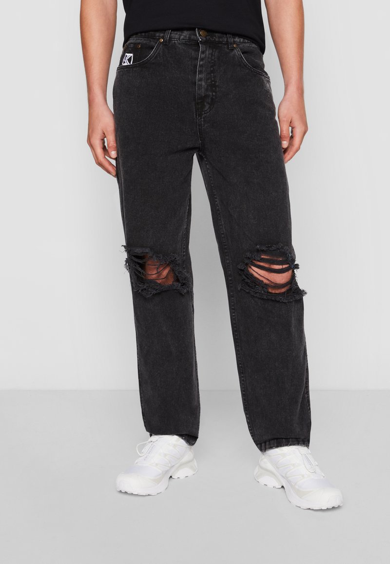 Džíny s širokými dírami Karl Kani 30