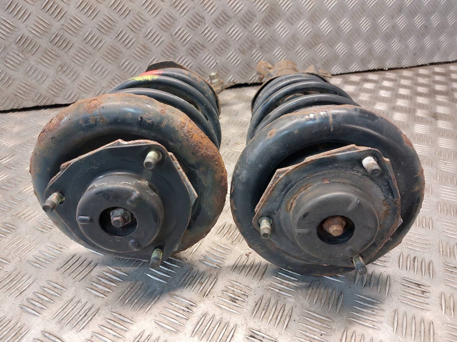 shock absorber spring left front right front NISSAN PRIMERA P12