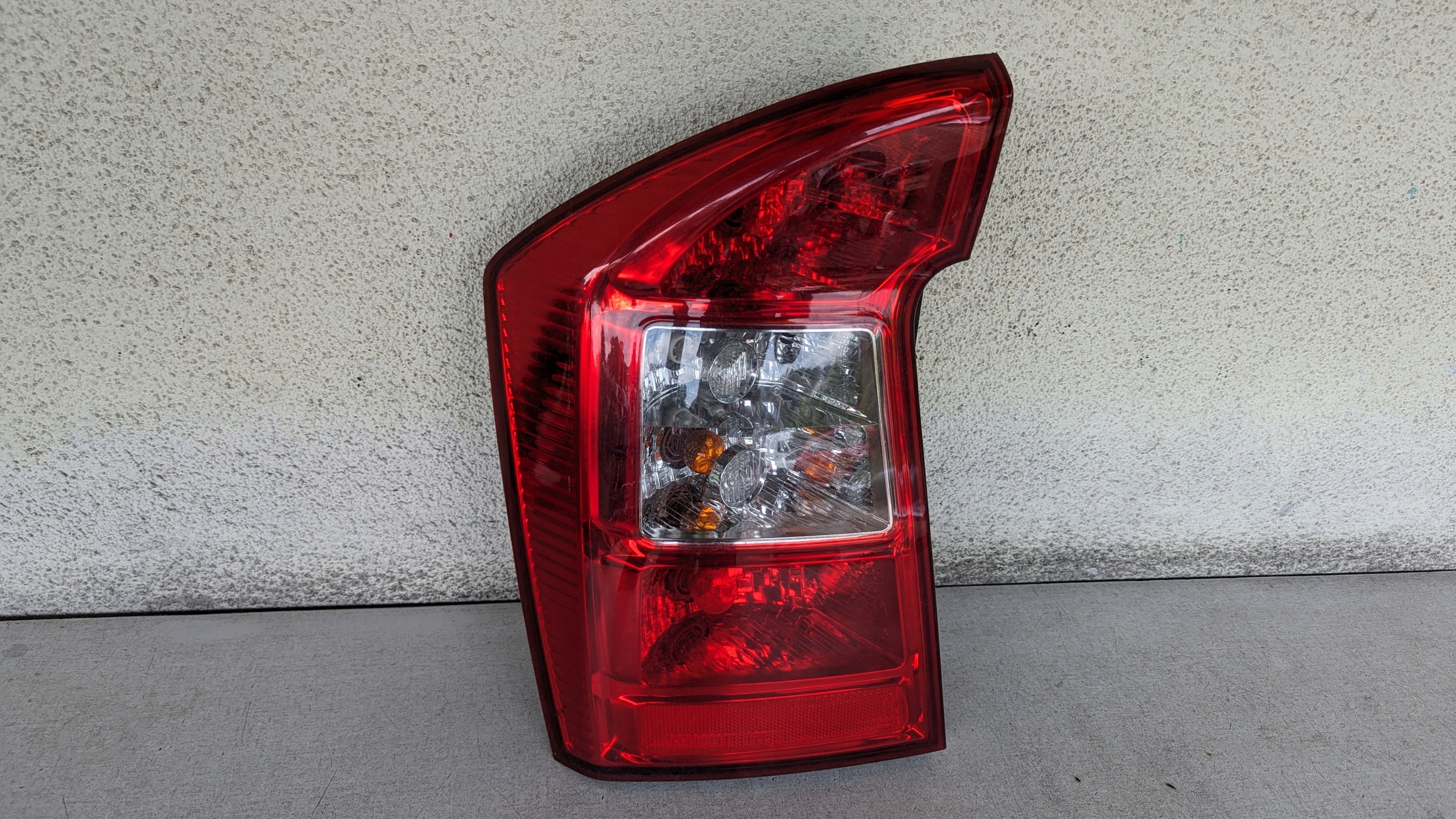 фонарь левый kia CARENS III