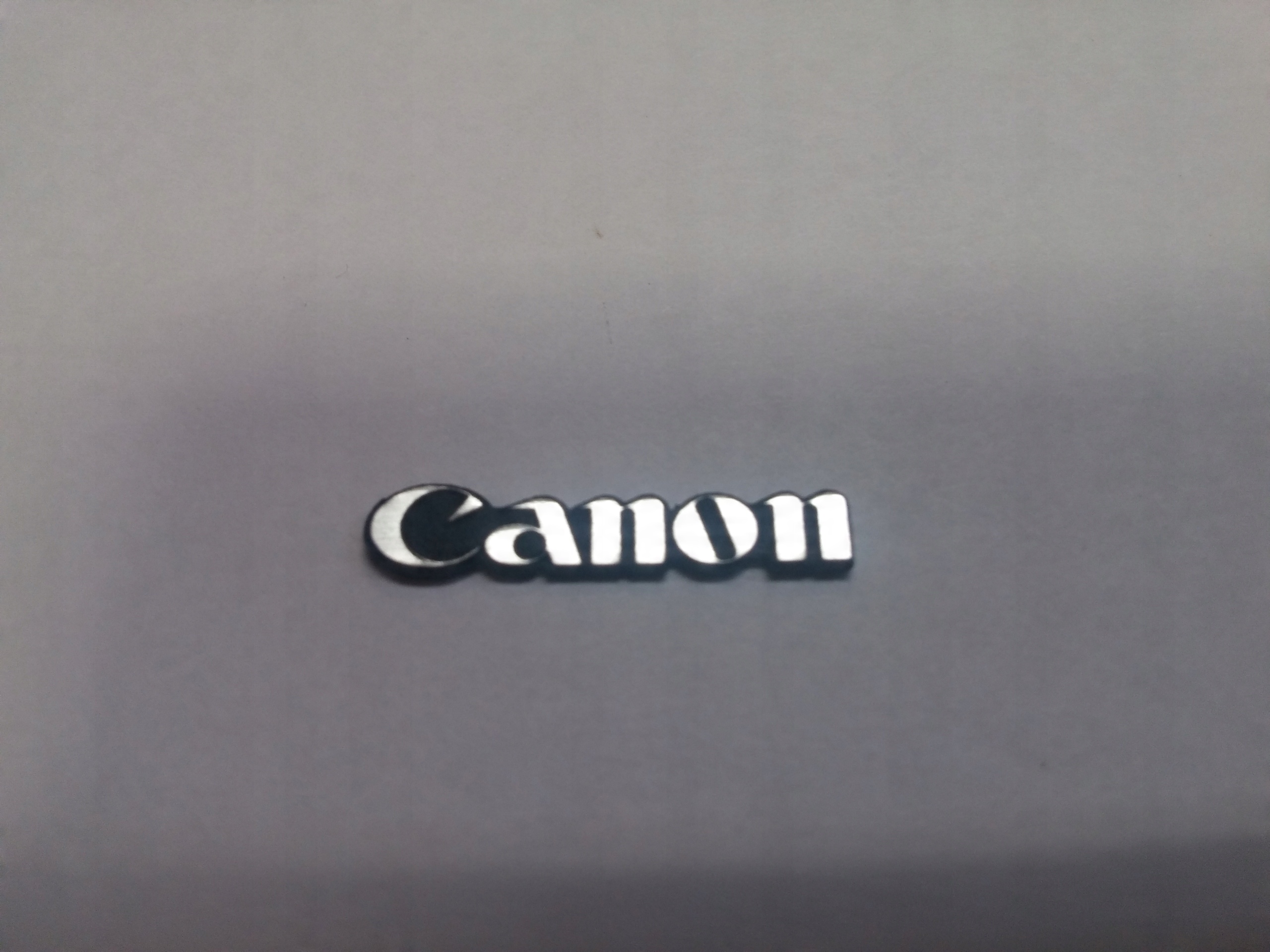 

Canon naklejka emblemat 30 x 6 mm *srebrna
