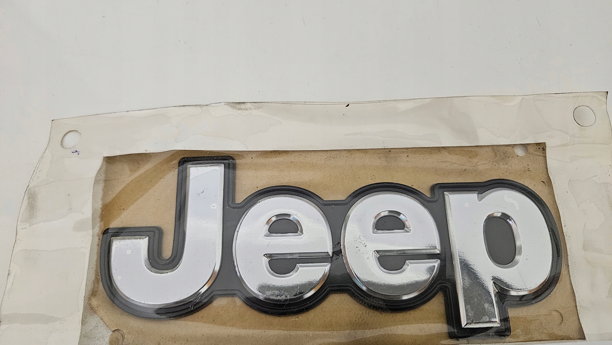 JEEP GRAND CHEROKEE EMBLEMAT NAPIS 68217340AA