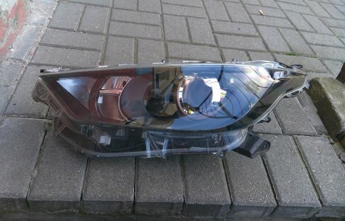 TOYOTA YARIS IV 4 19- LEWA PRZEDNIA LAMPA SOCZEWKA KOITO K0-6 EU ORYGINAŁ
