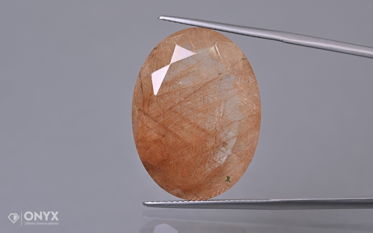 Křemen s rutilem fazetovaný ovál 27x20,5 mm