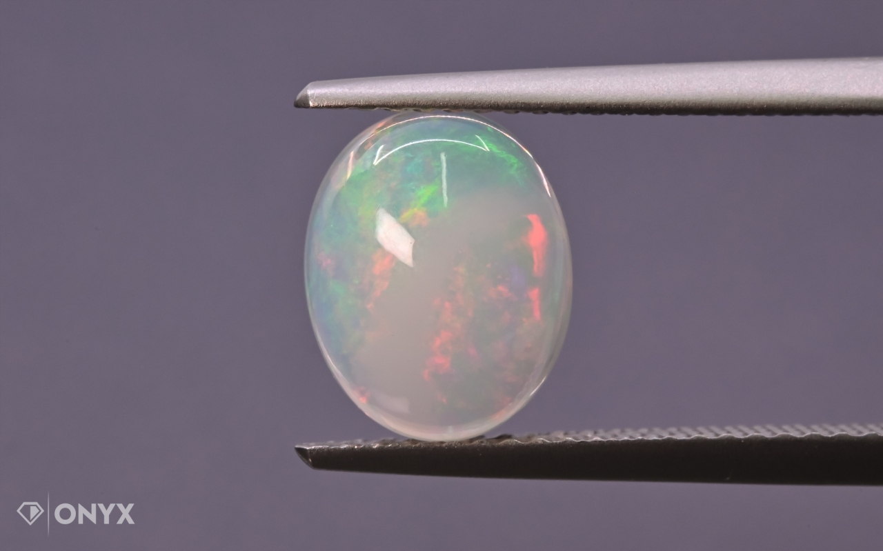Opál z Etiopie kabošon ovál 10x8 mm