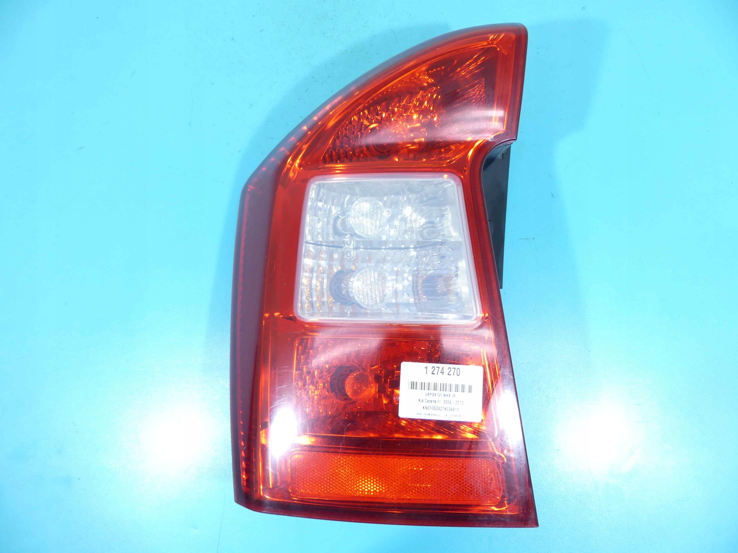 фонарь левый kia CARENS III 06-13 HB