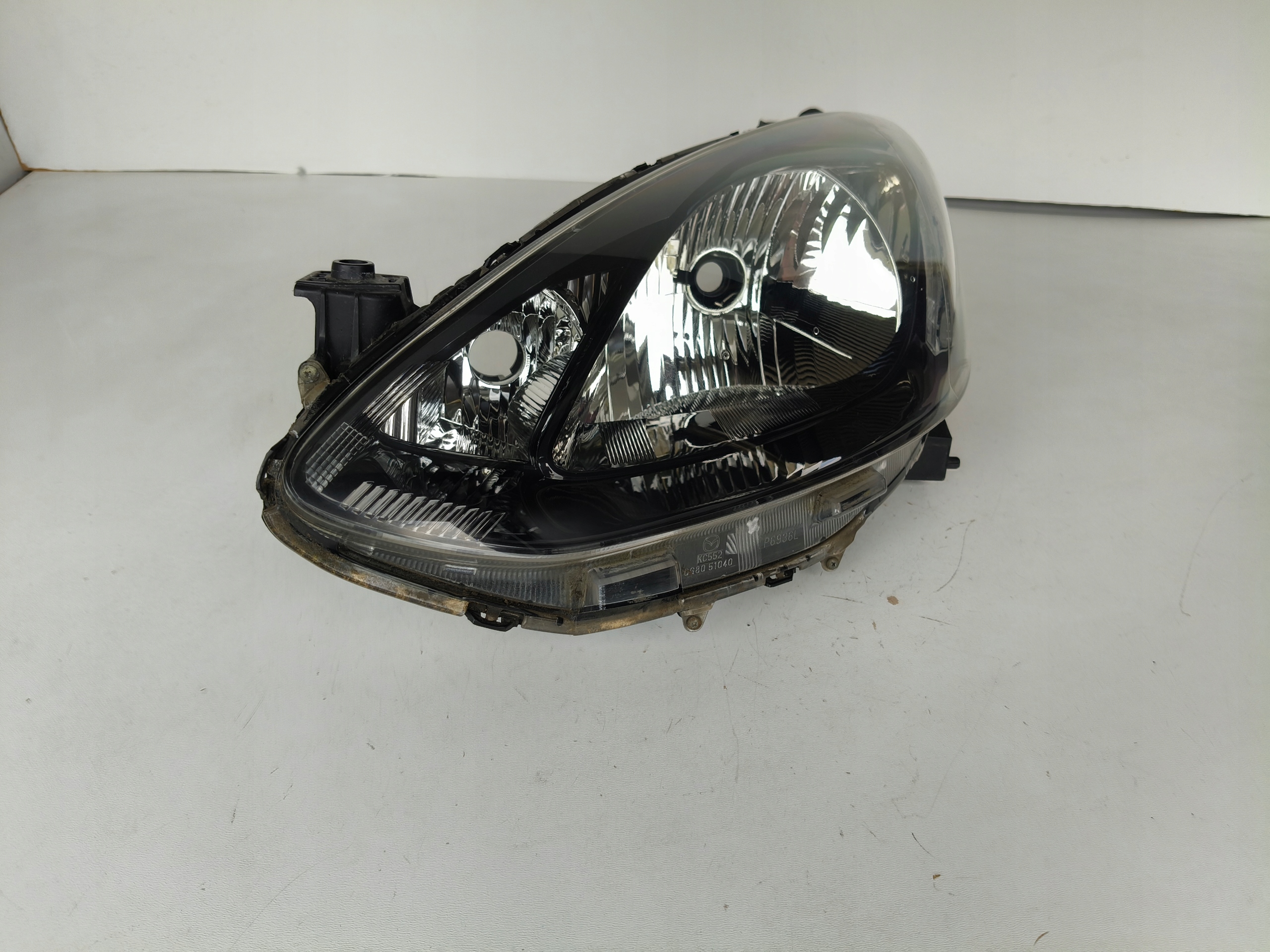 light left REFLEKTOR MAZDA 2 07
