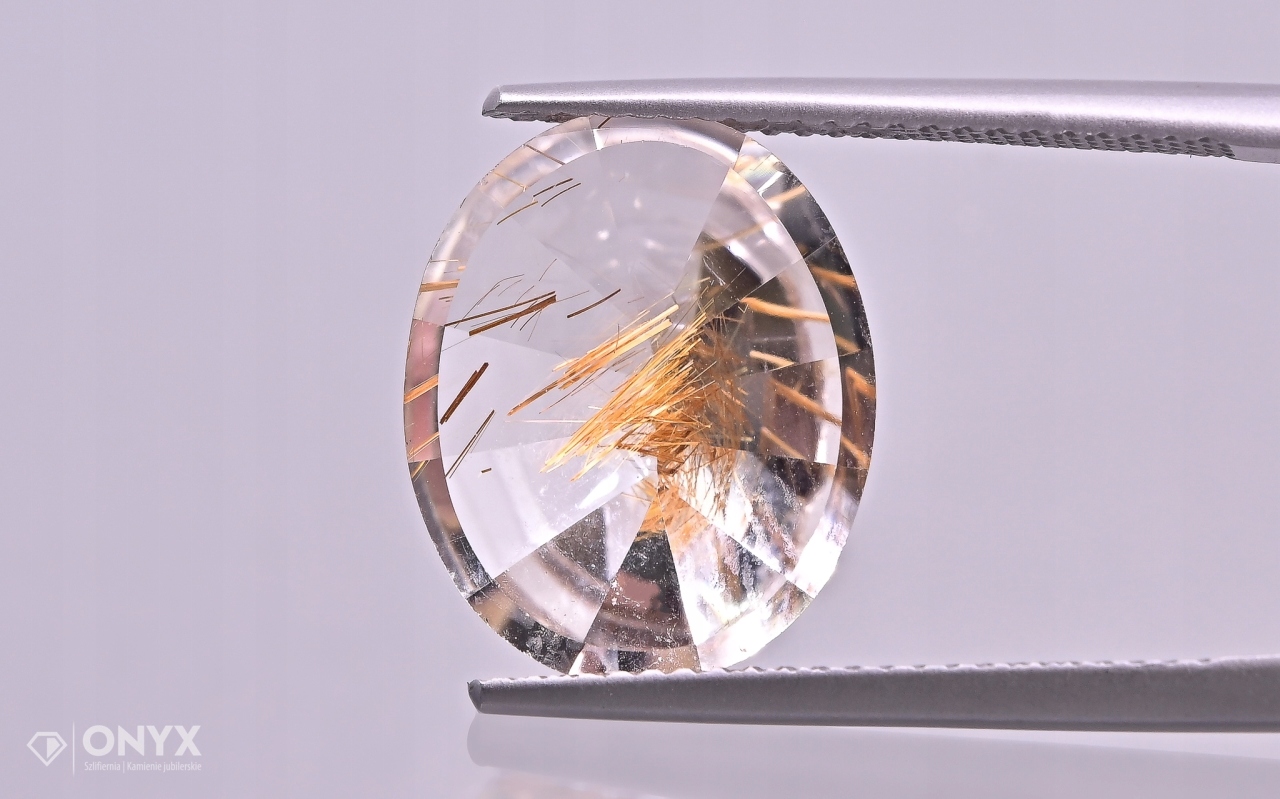 Křemen s rutilem fazetovaný ovál 15x12 mm