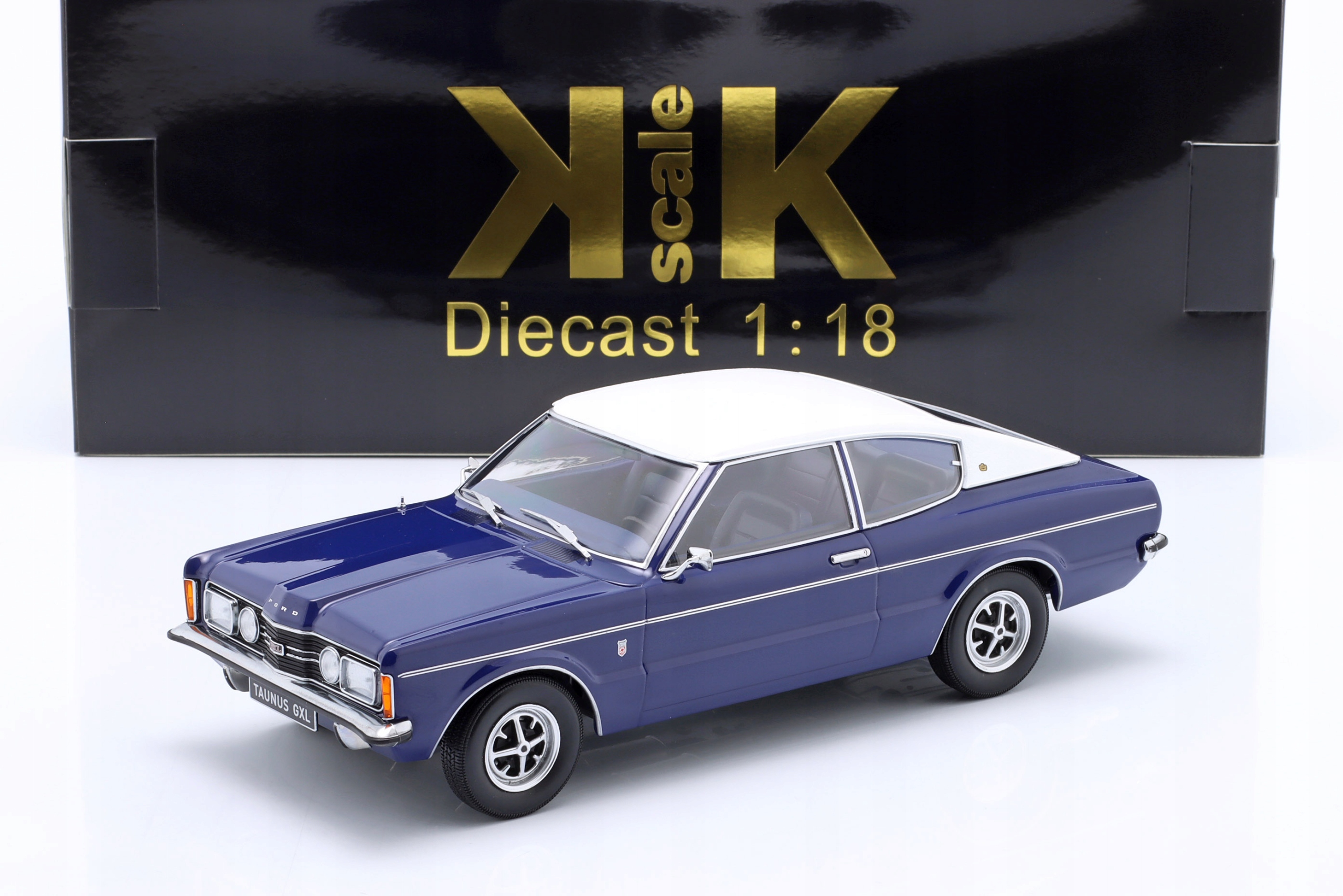 Kk Měřítko Ford Taunus Gxl kupé 1971 tmavě modrá/bílá 1:18