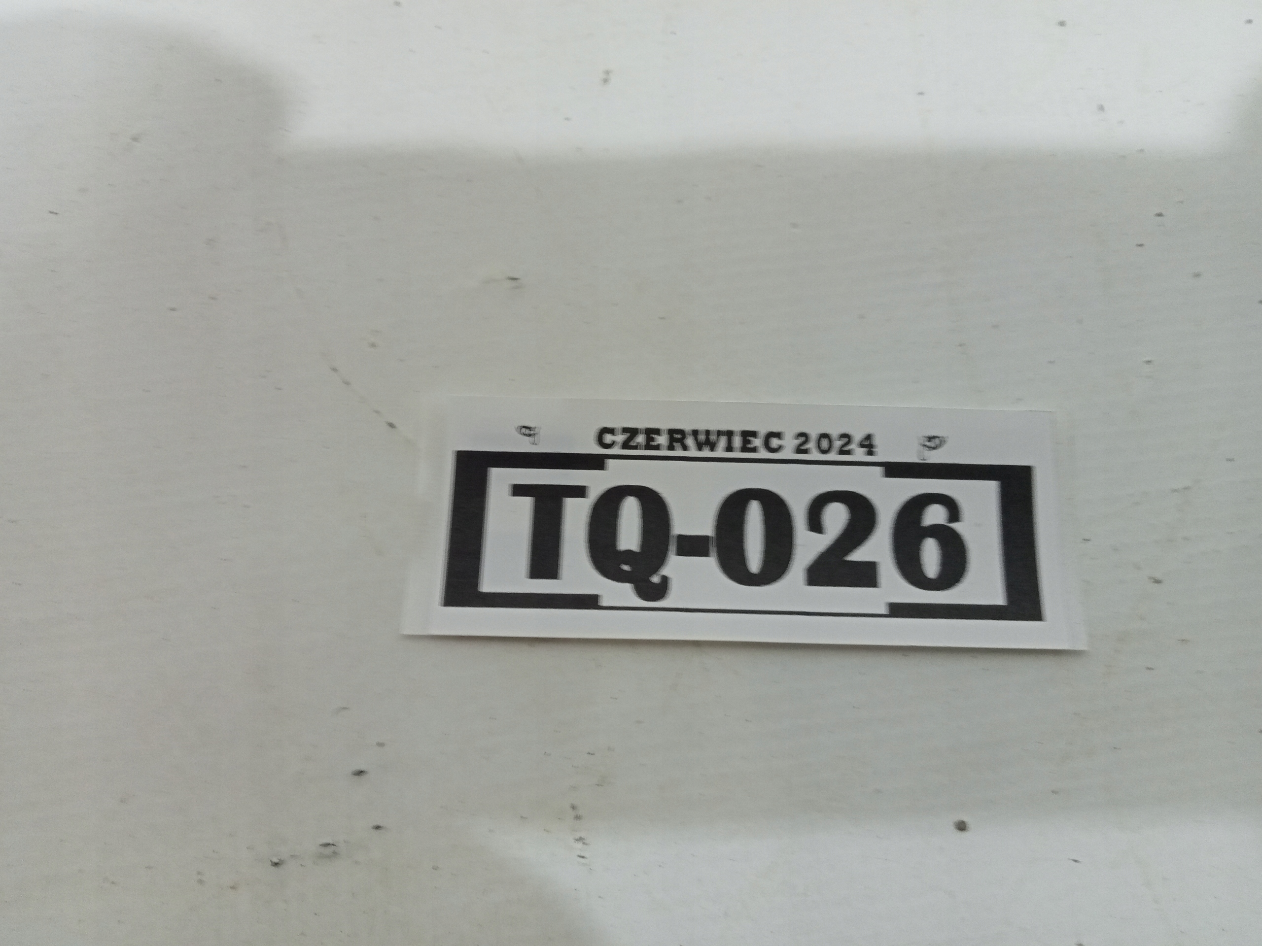 TQ-026 ZNACZEK EMBLEMAT ATRAPY PRZÓD COROLLA VERSO 04-07 75311-0F010 Marka Toyota