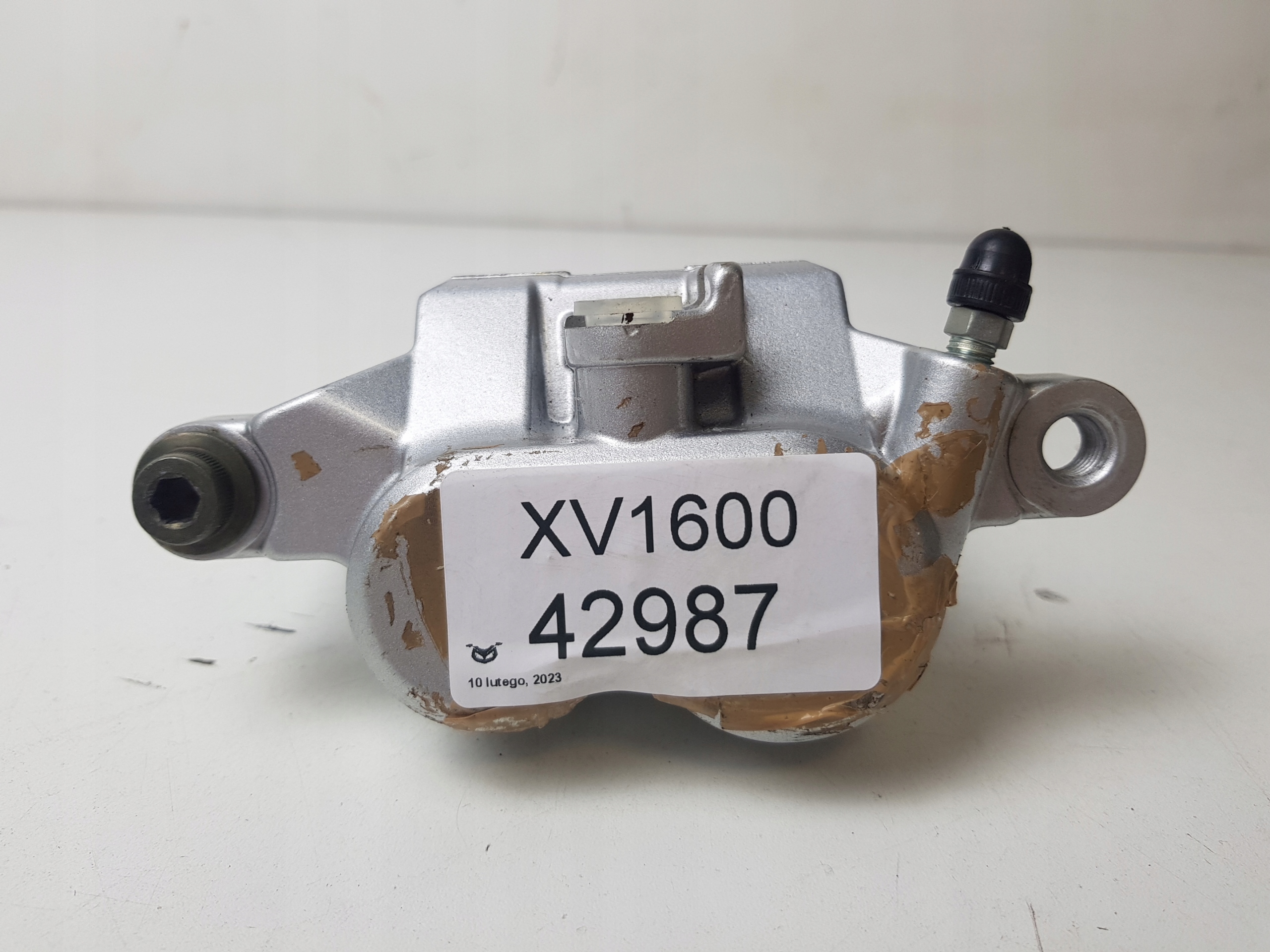 YAMAHA XV1600 ZACISK HAMULCA PRZÓD PRAWY