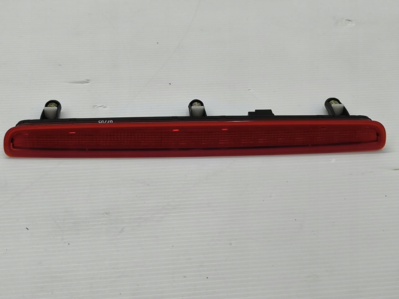 VW TRANSPORTER V T5 LAMPA STOPU LEWA 7E0945097E