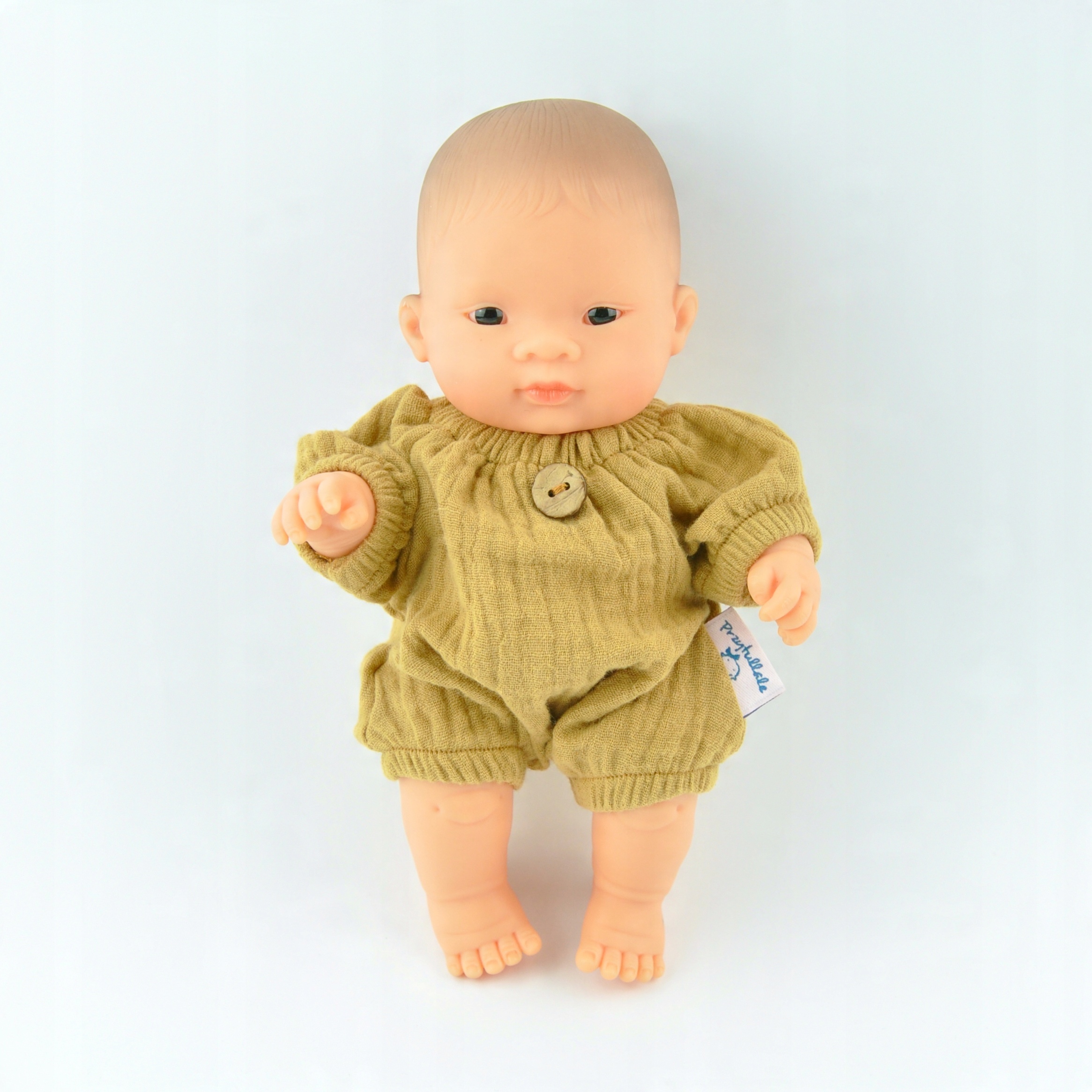 

Kombinezon musztardowy z muślinu dla Miniland 21cm