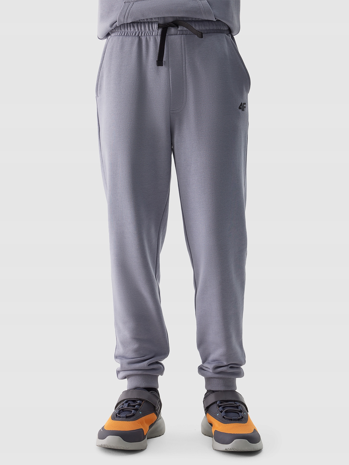 SPODNIE 4F CHŁOPIĘCE DRESOWE JOGGERY - JASNO NIEBIESKIE r. 158 Kolor niebieski