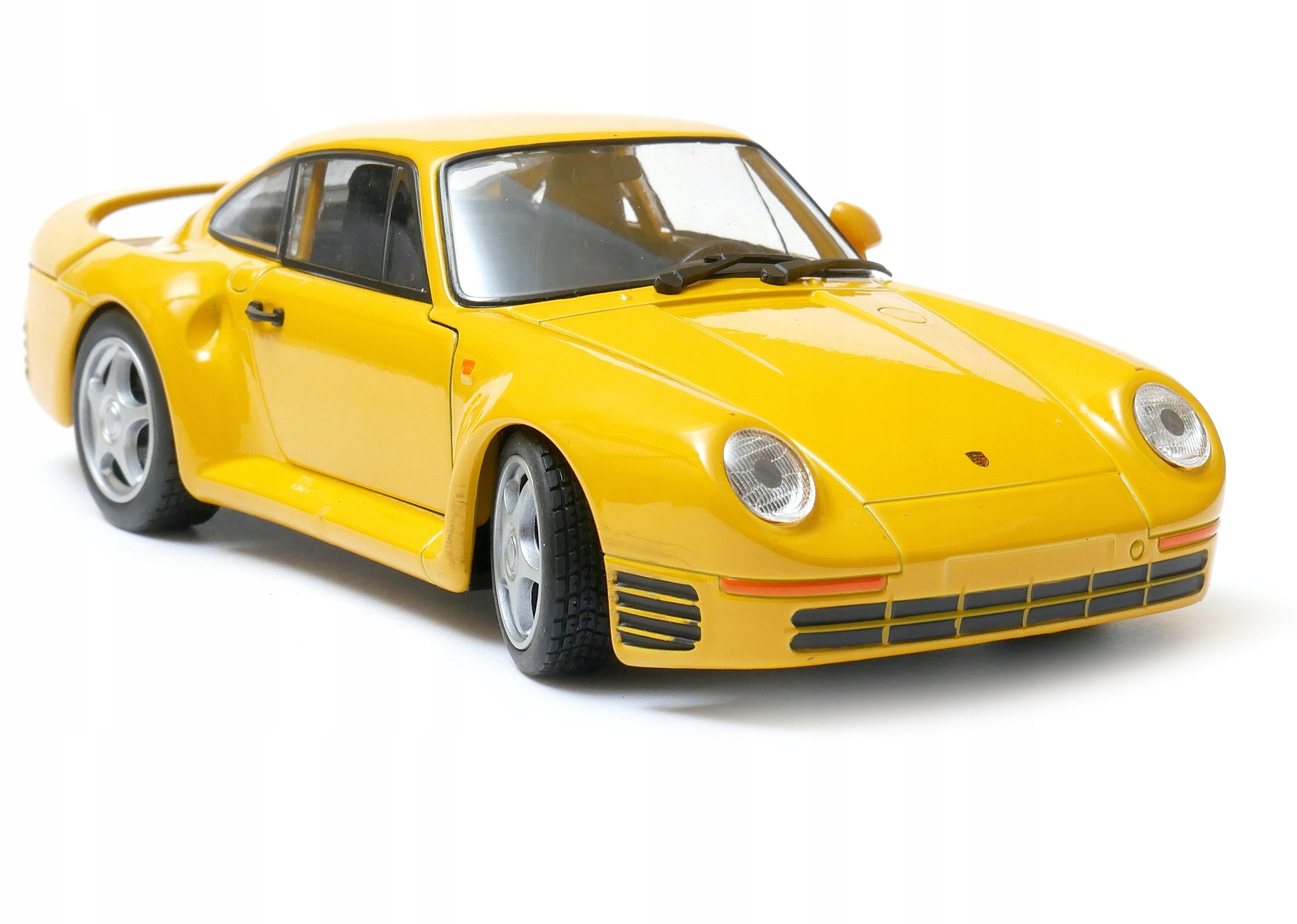 Porsche 959 1:24 model Welly 24076 žlutá
