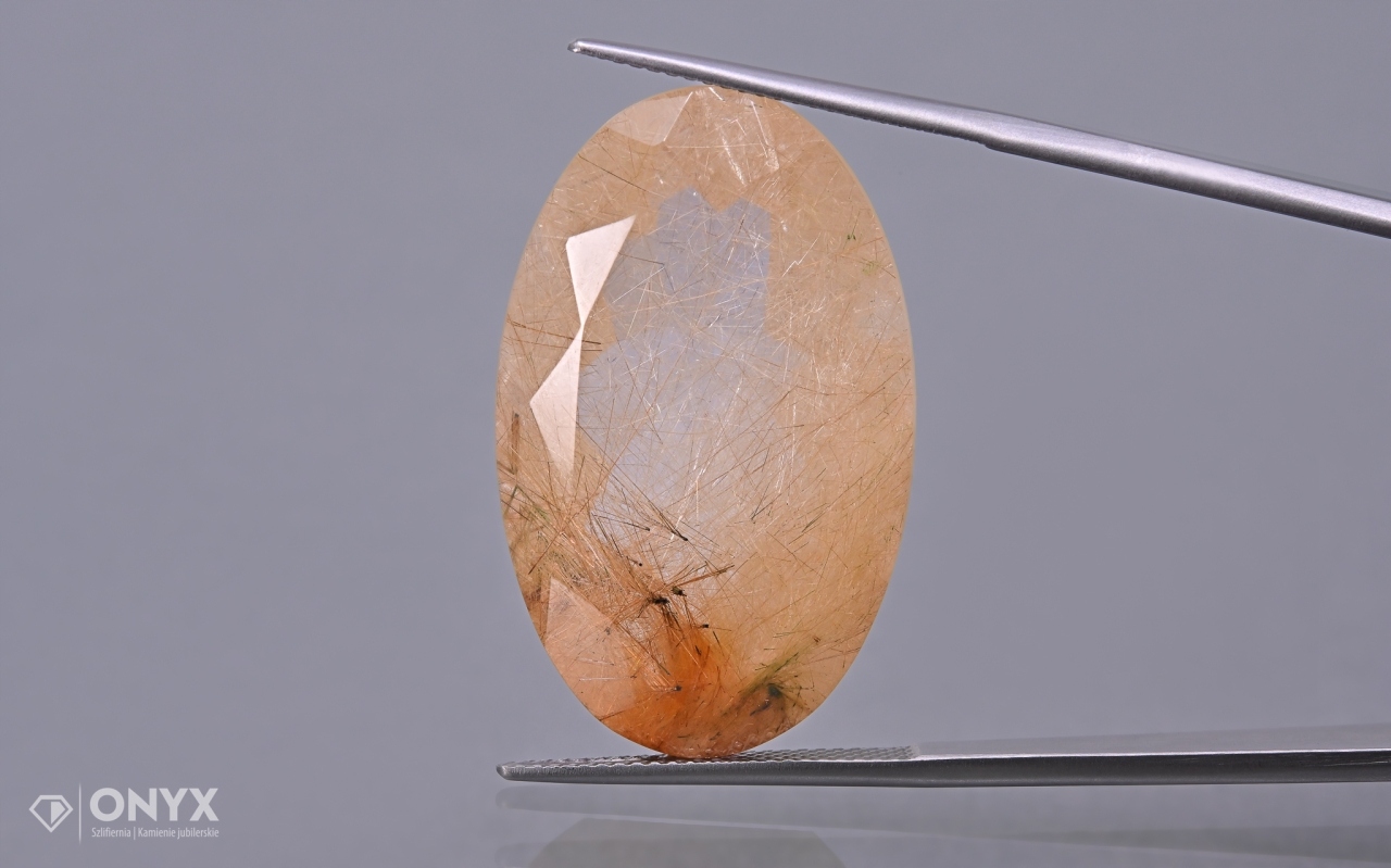 Křemen s rutilem fazetovaný ovál 32,5x20 mm